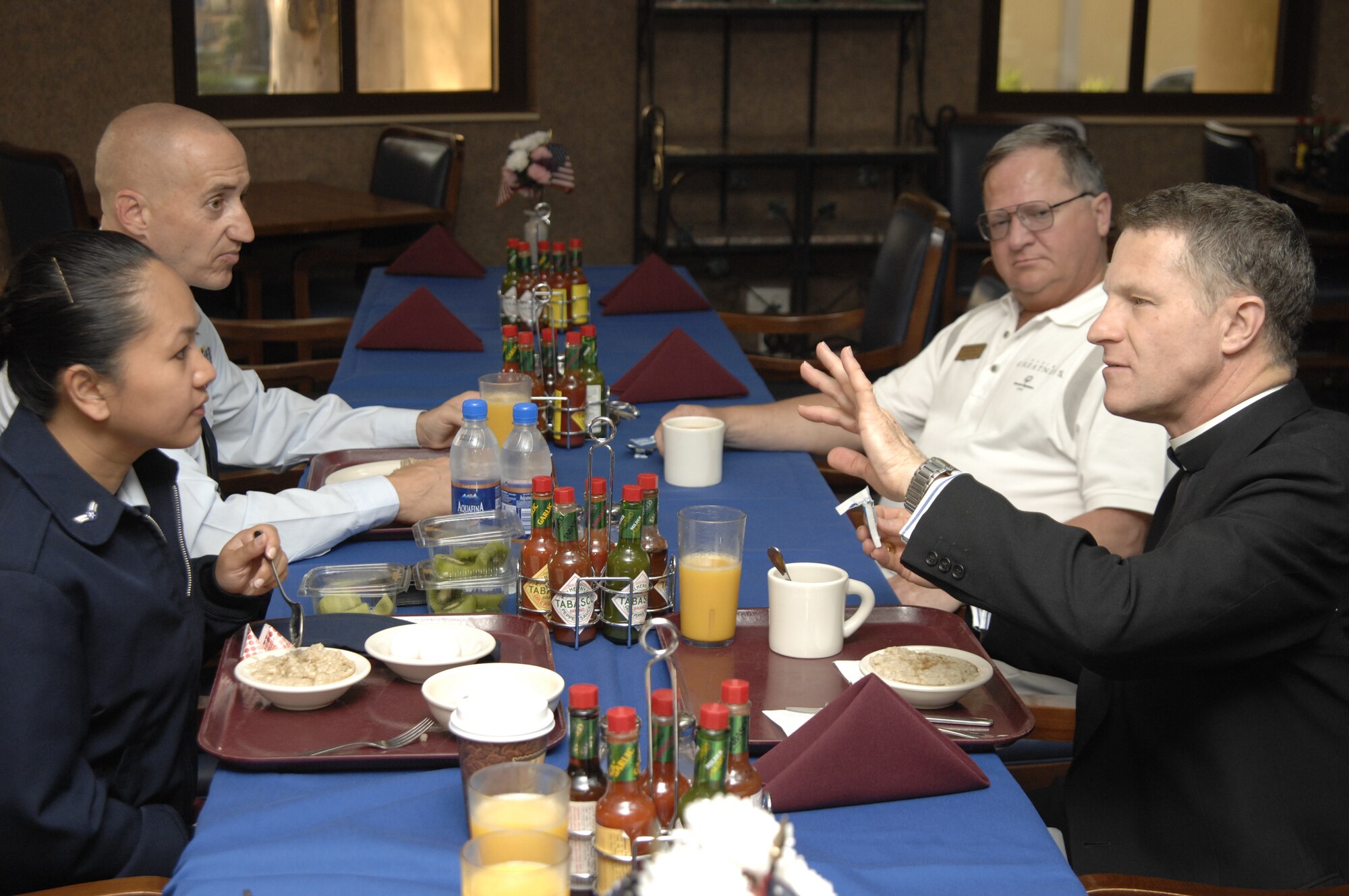 Roman Catholic Archbishop of Military Services USA Timothy Broglio speaks with (from left) Airman 1st Class Marilyn Ballester, 39th Logistics Readiness Squadron, Tech. Sgt. Kenneth Paul, 39 LRS, and Bill Schueller, Education office, during a breakfast at the Incirlik Sultan’s Inn dining facility, April 27. Archbishop Broglio visited Incirlik as part of his tour of U.S. military bases, which took him to South Korea for Christmas and Iraq for Easter. The Archbishop is in charge of the largest diocese in the Roman Catholic Church estimated to contain 1.5 million parishioners made up of military personnel worldwide and Department of Defense civilians serving overseas. (U.S. Air Force photo/Senior Airman Benjamin Wilson)