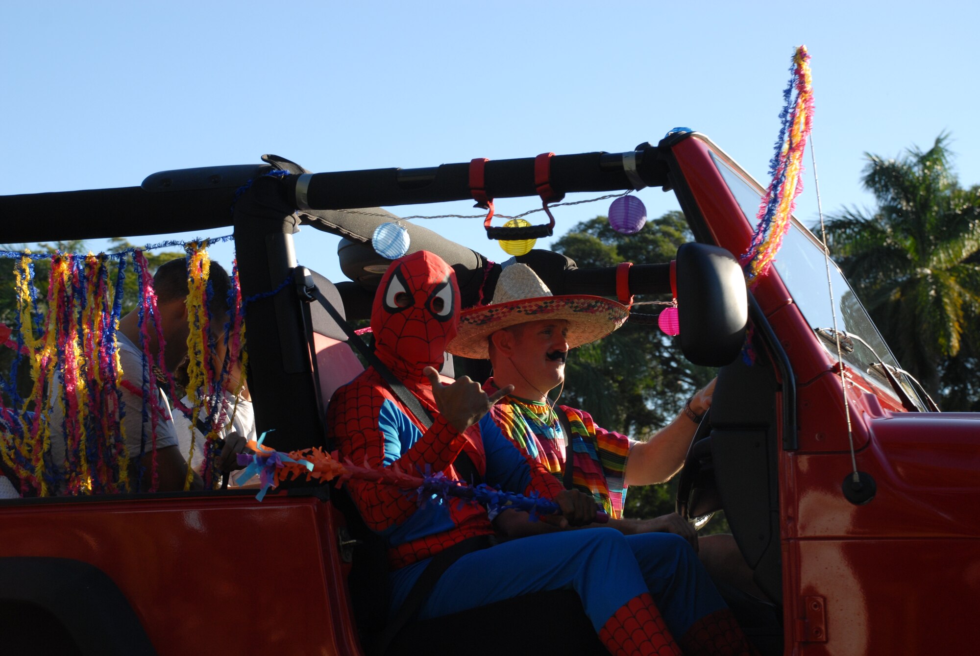 HICKAM AIR FORCE BASE, Hawaii – 15th Airlift Wing executive officer Capt. Carl Miller, dressed in a sombrero and festive Cinco de Mayo gear, along with 15 AW protocol specialist Pete Cruz, dressed as Spiderman, lead Team Hickam’s monthly Warrior Run at the Freedom Tower Mall May 1. Each month, a different Hickam AFB agency is in charge of setting up, organizing, and executing the run. More than 926 Hickam servicemembers participated in this month’s themed event. (U.S. Air Force photo/Staff Sgt. Erin Smith)