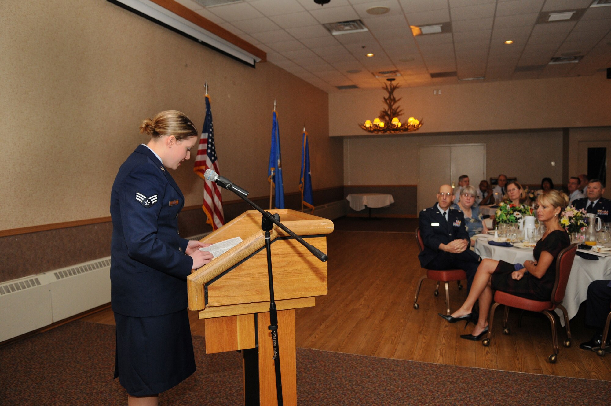 Senior Airman Heidi Greer reads scripture during a National Prayer Breakfast May 4, 2009 Eielson Air Force Base, Alaska.  Airman Greer is with 354th logistics readiness squadron.  (U.S. Air Force photo/Airman 1st Class Laura Max)