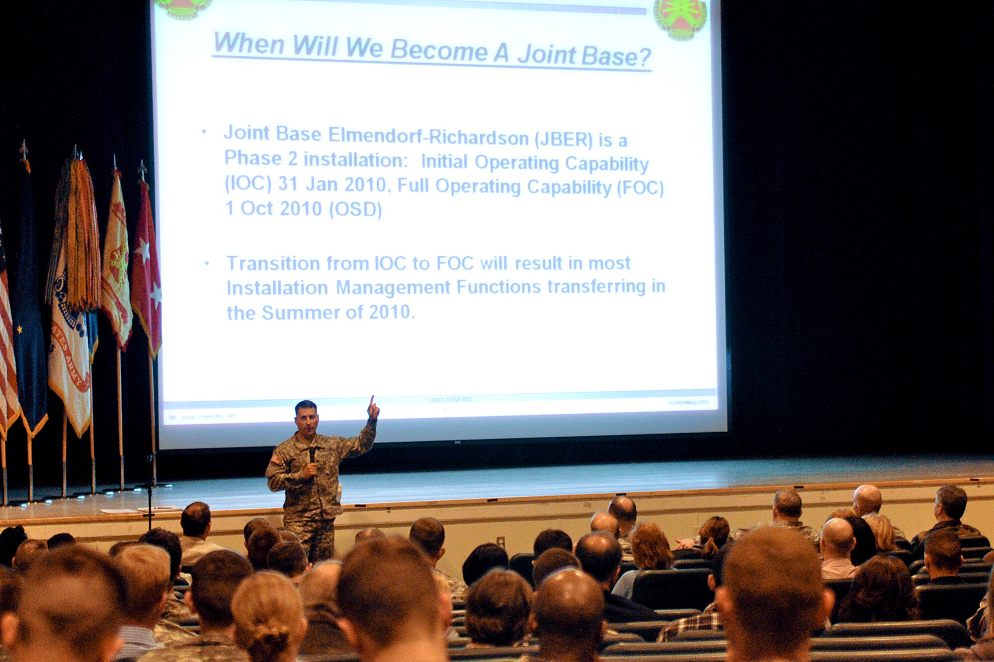 FORT RICHARDSON, Alaska -- Fort Richardson Garrison Commander Col. David L. Shutt explains the reasoning behind joint basing to a group of Soldiers, civilians and family members at the Post Theater May 5. Shutt and his principal staff members explained the ongoing process of combining Fort Richardson and Elmendorf Air Force Base into Joint Base Elmendorf-Richardson. The Joint Basing Town Hall was the first in a series of planned events to keep the Richardson and Elmendorf communities informed about the process. (U.S. Army photo/John Pennell)