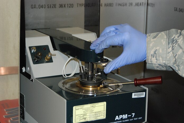The Petroleum, Oils and Lubricants labratory takes daily samples of fuel to check for contaminants and water before fuel is distributed on base. Seven different methods are used to ensure the highest quality of fuel. (Photo by Airman 1st Class Chuck Broadway)
