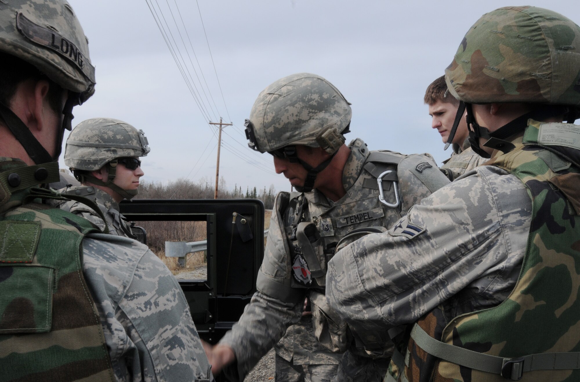 Tech. Sgt. Heath Tempel de-briefs the Airmen after an operational readiness exercise May 5, 2009, Eielson Air Force Base, Alaska. Operational readiness is important for Airmen safety. Sergeant Tempel is an explosive ordinance craftsman with the 354th Civil Engineer Squadron Explosive Ordinance Flight. (U.S.  Air Force photo/Airman 1st Class Laura Max)