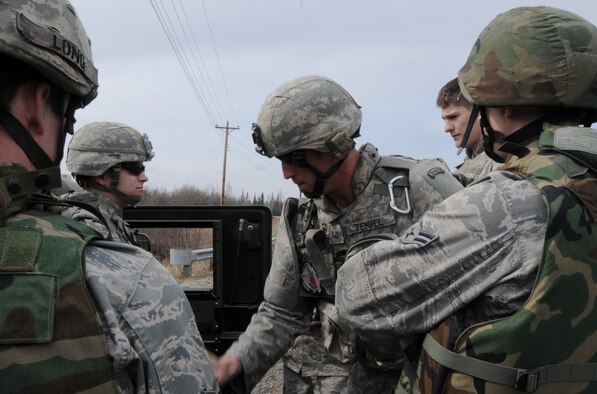 Tech. Sgt. Heath Tempel de-briefs Airmen after an operational readiness exercise May 5 at Eielson Air Force Base, Alaska. Operational readiness is important for Airmen safety. Sergeant Tempel is an explosive ordnance craftsman with the 354th Civil Engineer Squadron Explosive Ordnance Flight. (U.S. Air Force photo/Airman 1st Class Laura Max) 