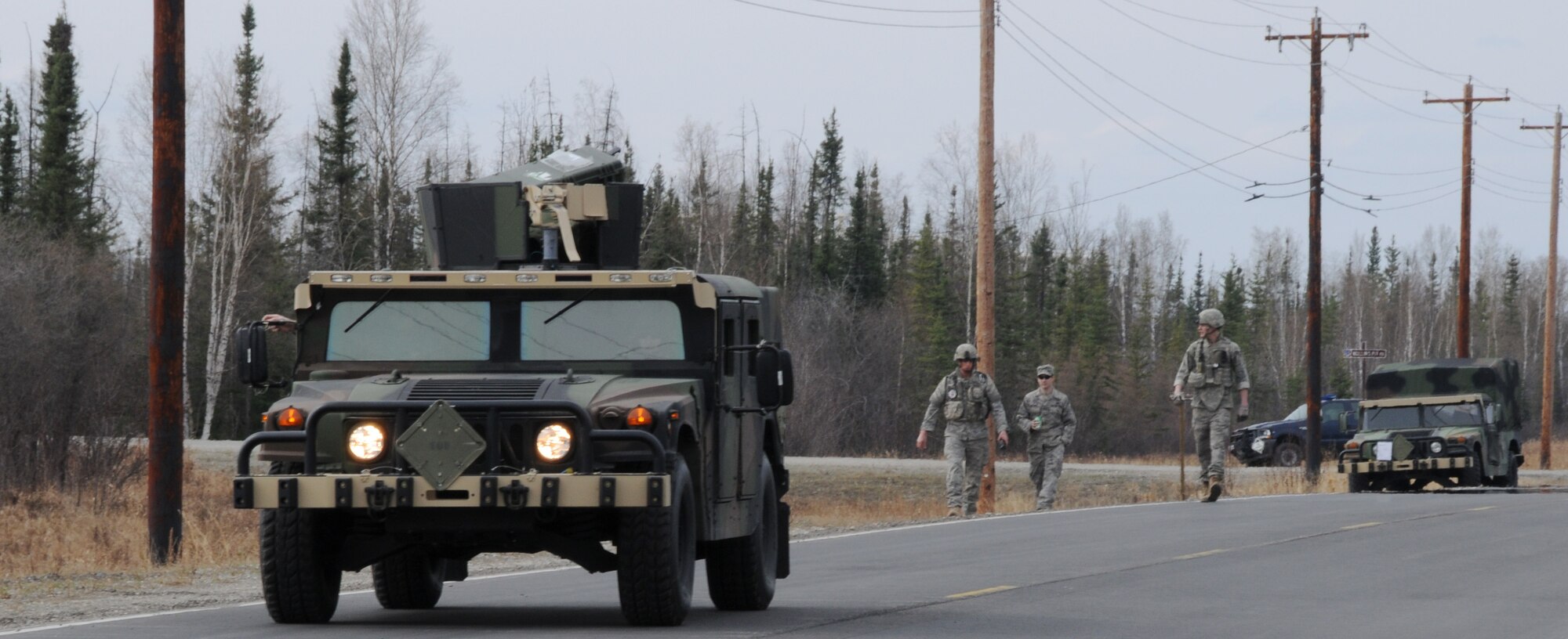 Airmen practice searching for improvised explosive devices and de-arming them to stay operational ready during an exercise May 5, 2009, Eielson Air Force Base, Alaska. Maintaining readiness is critical to Airmen safety.  The Airmen are with the 354th Civil Engineer Squadron Explosive Ordinance Flight. (U.S.  Air Force photo/Airman 1st Class Laura Max)