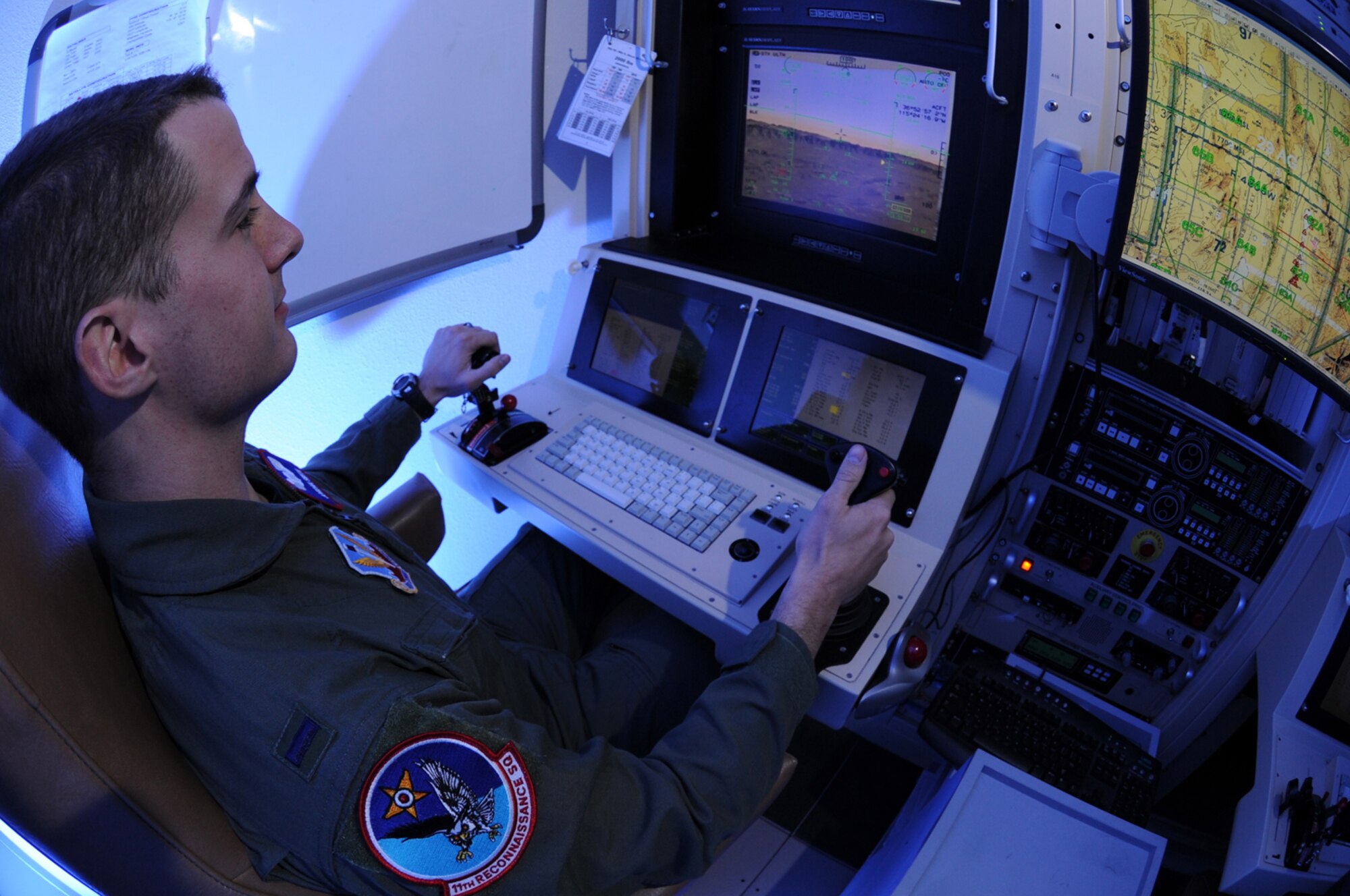 CREECH AFB, Nev. -- 1st Lt. Jordan Smith, a MQ-1B Predator student Pilot with the 11th Reconnaissance Squadron, operates the MQ-1B simulator at Creech April 22. (U.S. Air Force photo/Senior Airman Nadine Barclay)