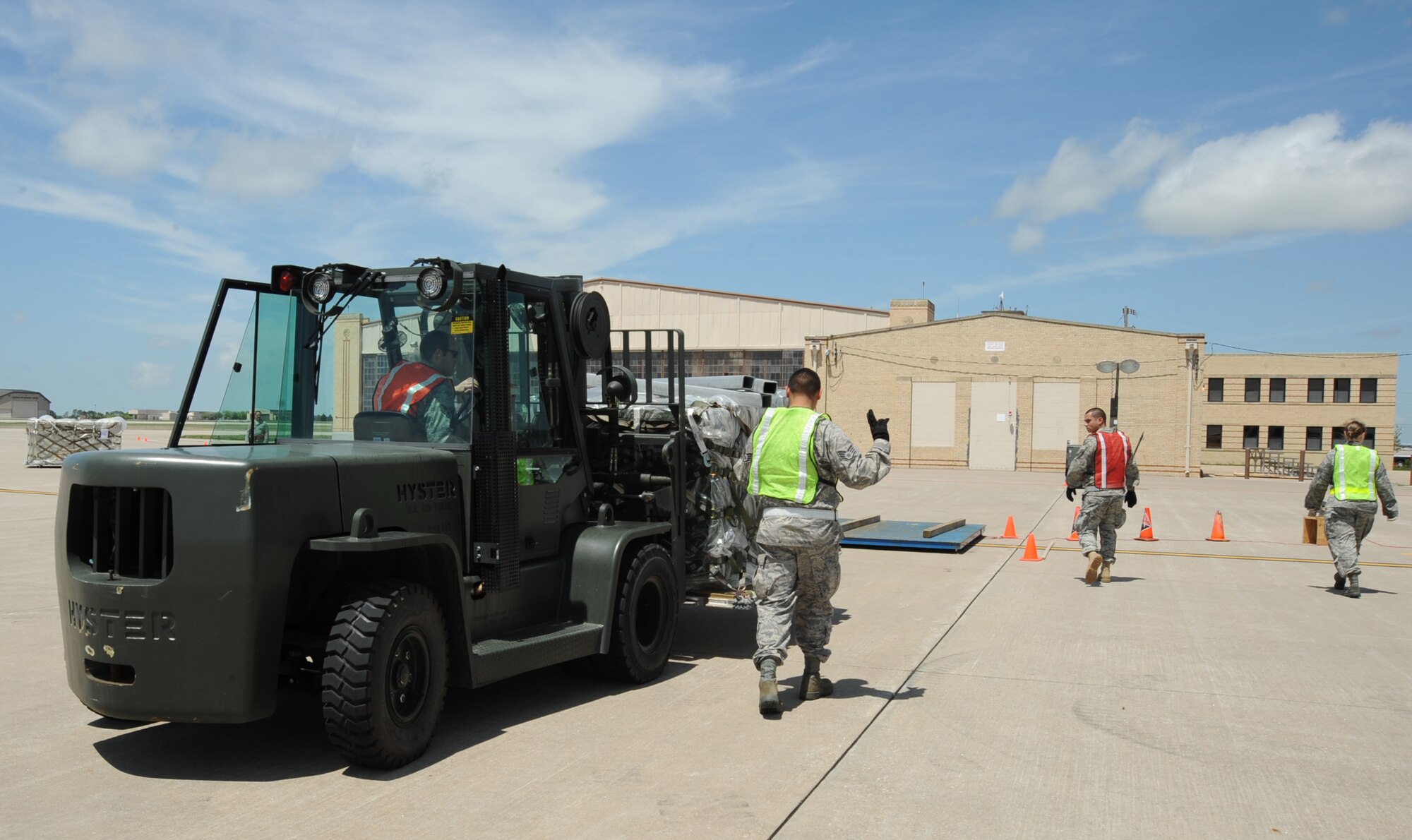 MCONNELL AIR FORCE BASE, Kan. -- Airmen zero a scale on the flight line soon to be loaded with a pallet during an operational readiness exercise, May 6. Each pallet leaving the flight line must be weighed before entering an aircraft so the maximum weight for cargo is not jeopardized. (Photo by Senior Airman Laura Suttles)