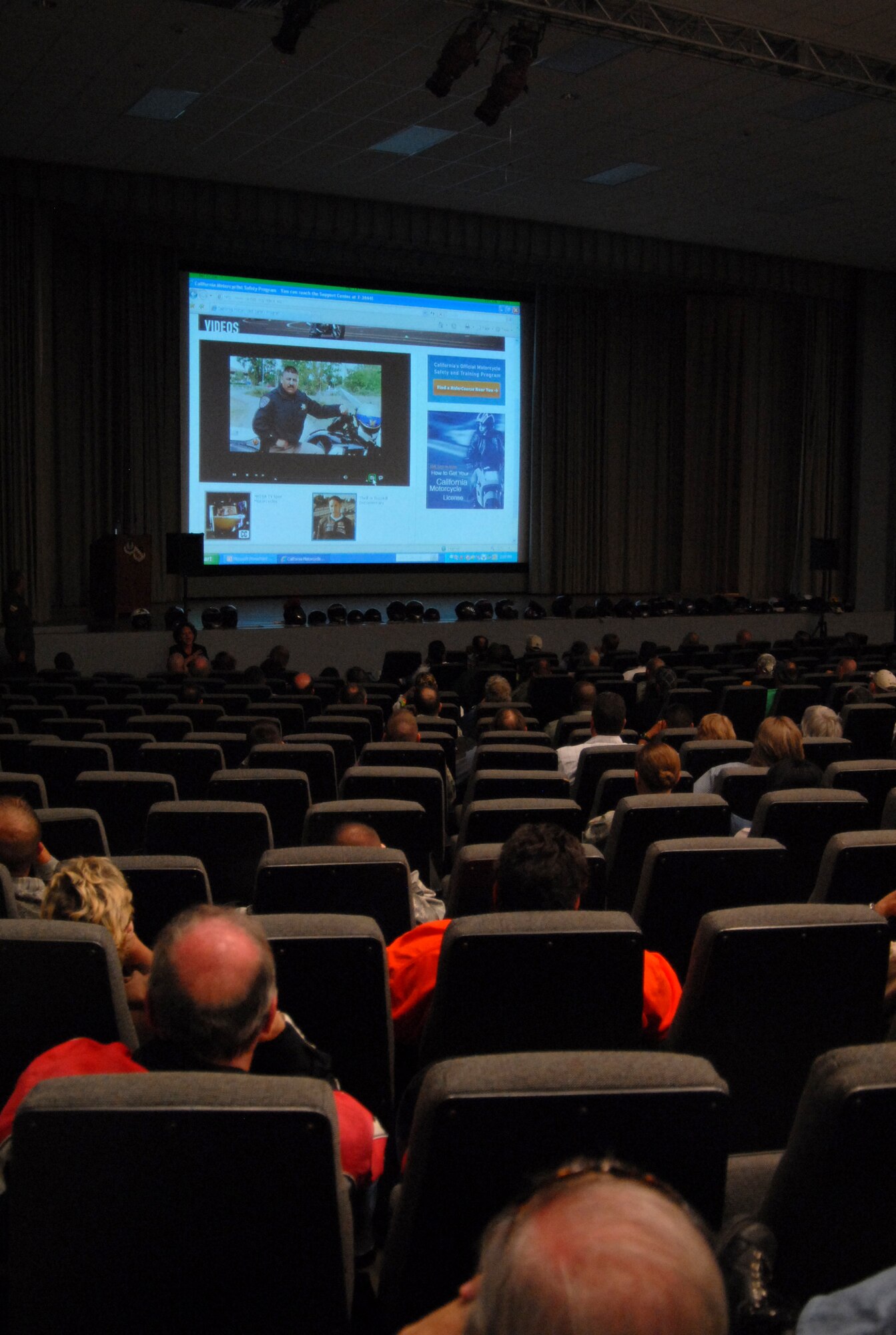 Military and civilian motorcycle riders watch a video during the Air Force Flight Test Center Safety mandatory safety briefing at the base theater May 6. The Ground Safety office hosted the event due to an increase in motorcycle accidents and incidents not only in the Air Force but across the Department of Defense. (U.S. Air Force photo/Senior Airman Julius Delos Reyes)