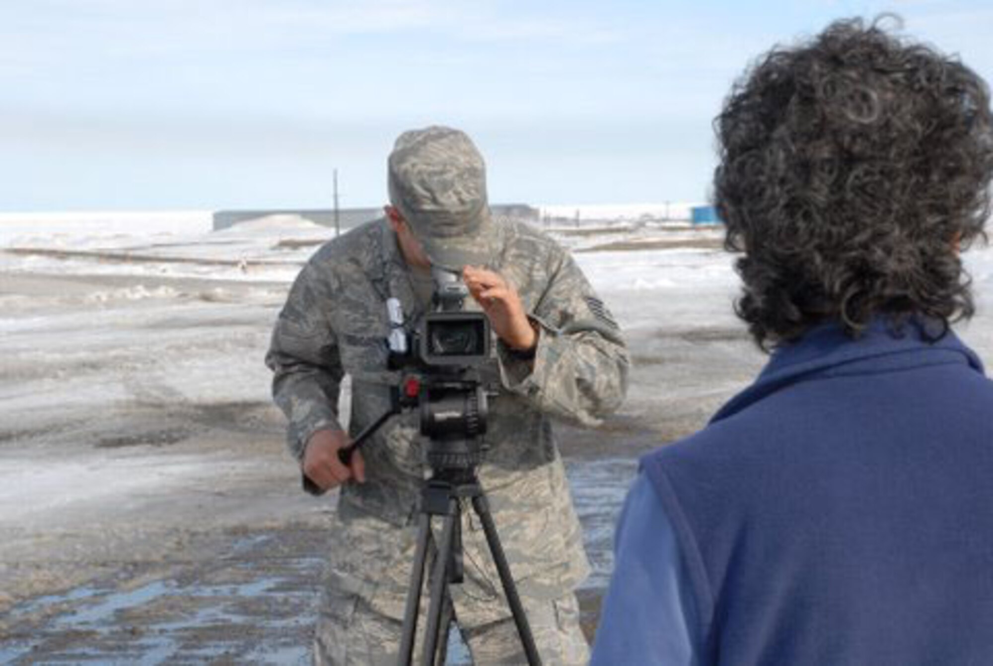 Staff Sgt. Daniel Delgado interviews Shele Kinkead, principal of the Harold Kaveolook School in Kaktovik, Alaska. Sergeant Delgado, a broadcaster with the 3rd Wing Public Affairs Office at Elmendorf Air Force Base, Alaska, was in Kaktovik April 27 as part of the Barter Island Radar Site open house. (U.S. Air Force photo/1st Lt. John Callahan)