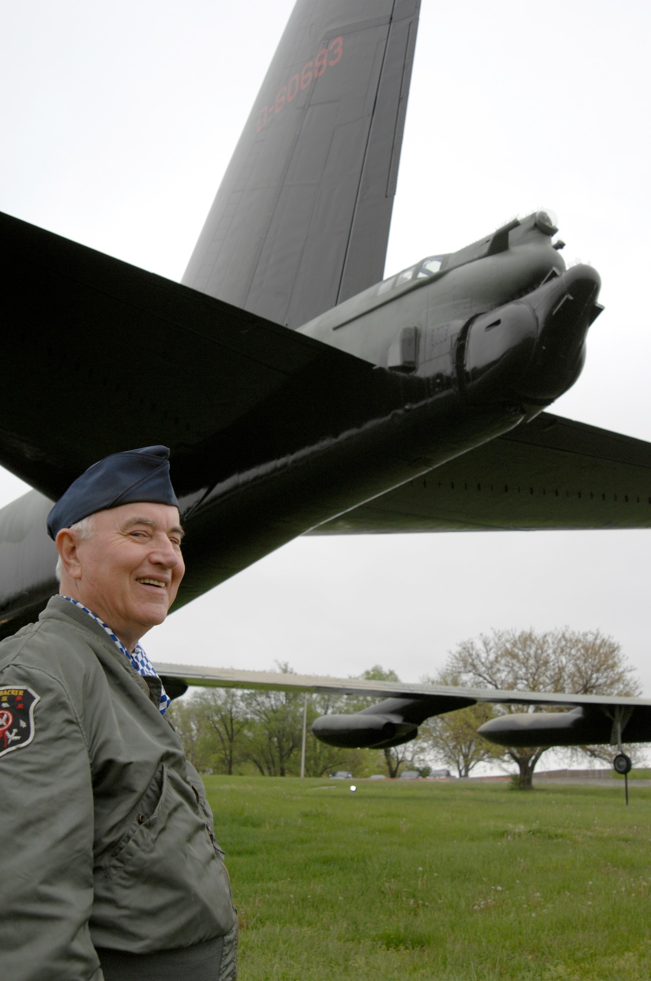 WHITEMAN AIR FORCE BASE, Mo. – Retired Master Sgt. Jerry Headrick, a former B-52 tail gunner, stands by the tail of an aircraft in which he logged combat hours during Vietnam.   Mr. Headrick is a friend of a fellow B-52 gunner whose crew the plane will be dedicated to.  (US Air Force Photo/Staff Sgt. Jason Barebo)  