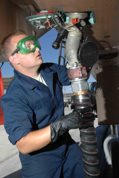 Staff Sgt. Jason Payne, an F-15 crew chief in the 926th Aircraft Maintenance Squadron, refuels an F-15 at Nellis Air Force Base, Nev. The 926th Group is an Air Force Reserve classic associate unit that supports the Regular Air Force’s U.S. Air Force Warfare Center at Nellis with Air Force reservists. (U.S. Air Force photo/Senior Airman Larry E. Reid Jr.)

