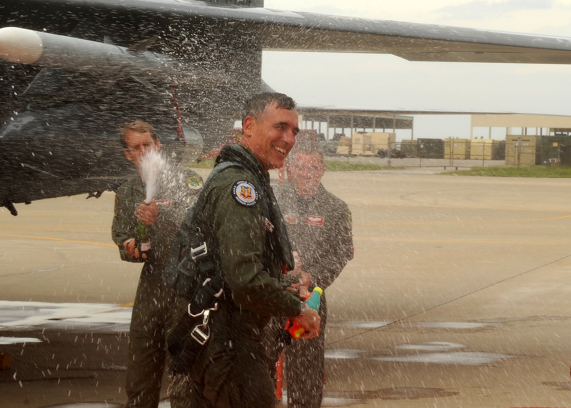 LANGLEY AIR FORCE BASE, Va. -- Maj. Gen. R. Mike Worden, Air Combat Command vice commander, is sprayed down with champagne by friends after his final flight here May 4. This is General Worden's last flight as vice commander, he will be retiring effective July 1. (U.S. Air Force photo/Airman 1st Class Jonathan Koob)