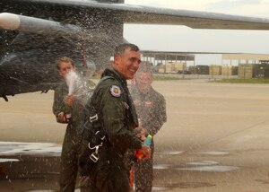 LANGLEY AIR FORCE BASE, Va. -- Maj. Gen. R. Mike Worden, Air Combat Command vice commander, is sprayed down with champagne by friends after his final flight here May 4. This is General Worden's last flight as vice commander, he will be retiring effective July 1. (U.S. Air Force photo/Airman 1st Class Jonathan Koob)