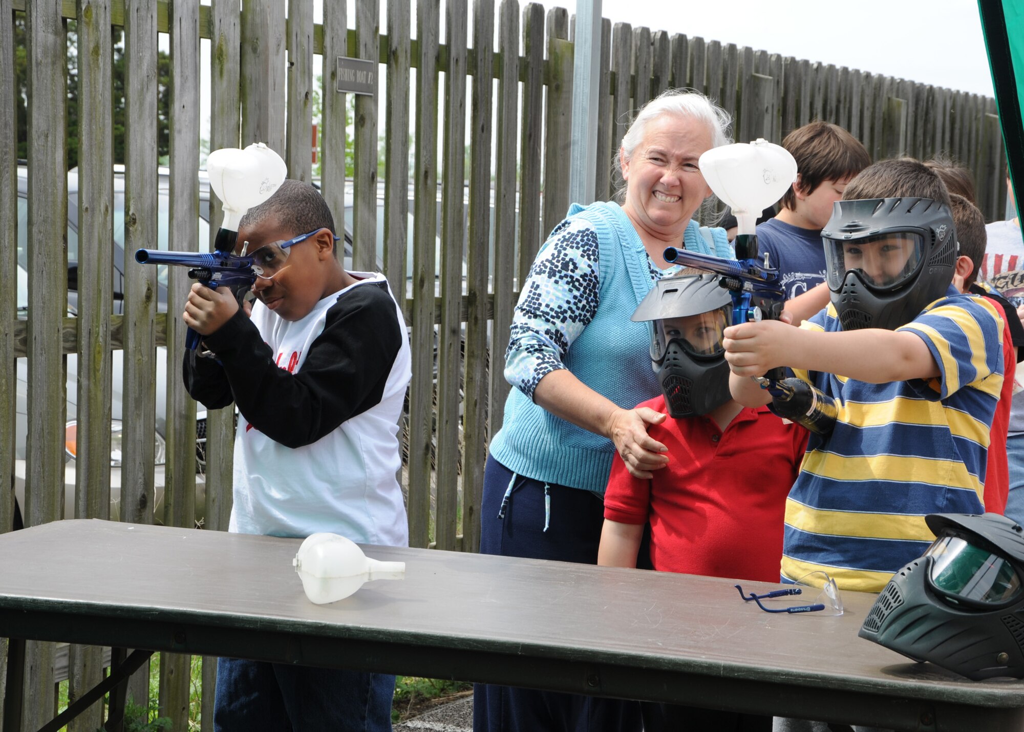 SCOTT AIR FORCE BASE, Ill. --Noah Bridge, 9, and Domenique Benjamic, 8, take aim at the paintball gun shooting booth at the Outdoor Recreation open house Saturday at Scott. The yearly event is held to inform Scott members about the different trip opportunities and equipment they have for rent.(U.S. Air Force photo/Airman 1st Class Wesley Farnsworth) 