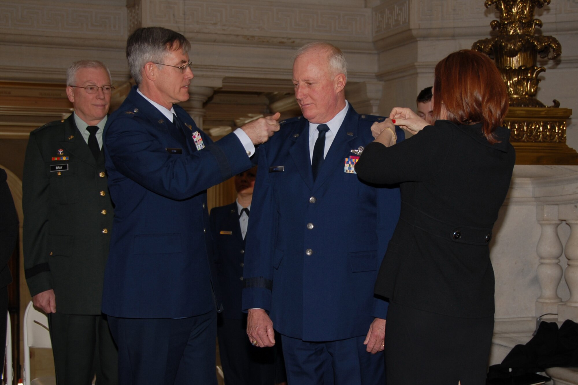 Major General (MG) Thomas J. Haynes, Air National Guard (ANG) assistant to the commander, Air Mobility Command (AMC), and former Assistant Adjutant General for Air, Rhode Island Air National Guard (RIANG), was promoted to Major General in the Rhode Island State House Rotunda, Providence, RI. MG Haynes was pinned by his wife, Barbara and MG (ret) Thomas Kane, former director of plans and programs for AMC. USAF Photo taken by Technical Sergeant Jason Long (Released)