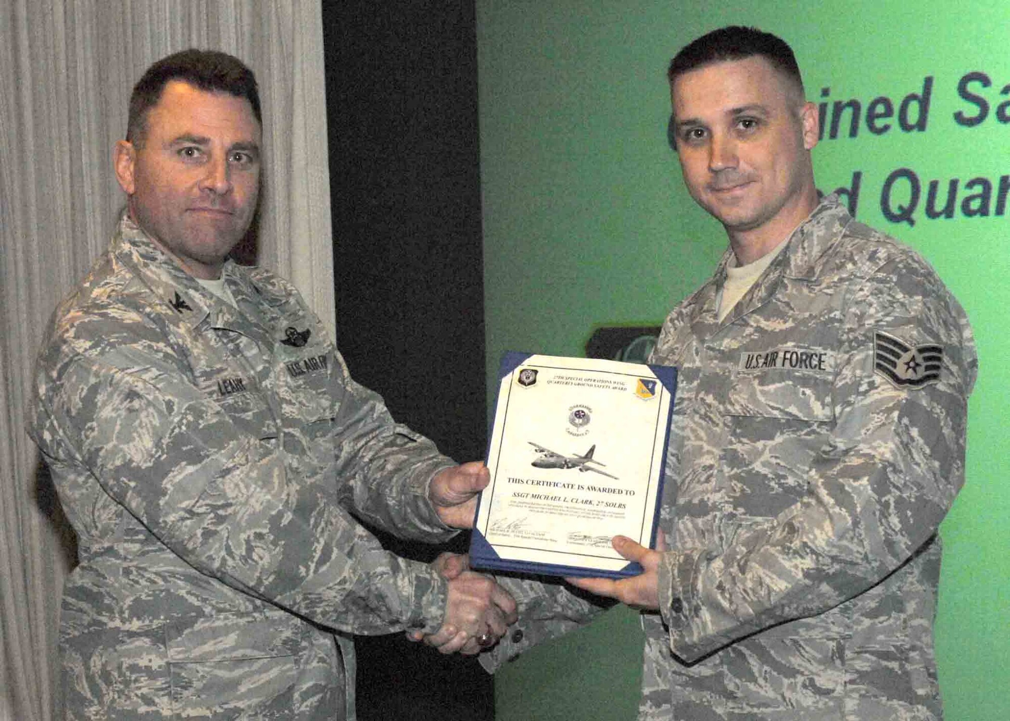 CANNON AIR FORCE BASE, N.M. -- Staff Sgt. Michael Clark, 27th Special Operations Logistic Readiness Squadron, receives the Quarterly Ground Safety Award presented by Col. Timothy Leahy, 27th Special Operations Wing commander. Sergeant Clark received the award at the weekly wing staff meeting on May 5.  (U.S. Air Force photo/Airman 1st Class James Bell)