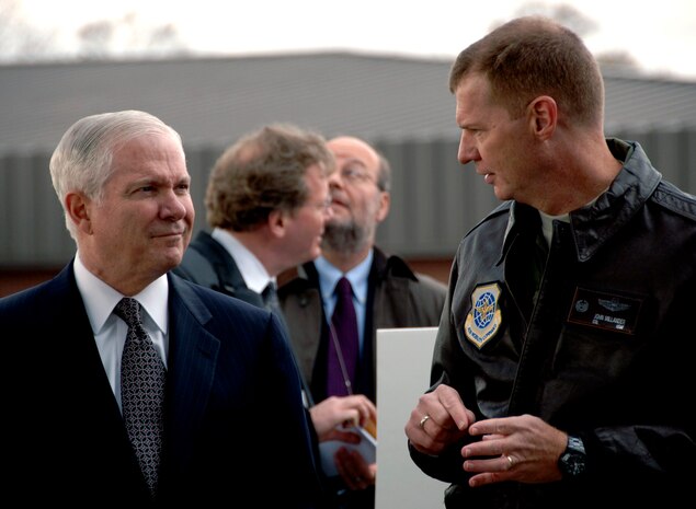 Col. John “Red” Millander speaks with Secretary of Defense Robert Gates on the Charleston AFB flightline Dec. 18, 2007. Colonel Millander discussed with the secretary of Defense the role Charleston AFB plays in the distribution of Mine Resistant Ambush Protected Vehicles to deployed units. (U.S. Air Force photo/Airman 1st Class Katie Gieratz)