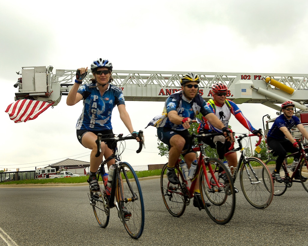 Participants in the wounded warrior soldier ride cycle through the North gate as they exit Andrews Air Force Base Md., on May 1, 2009. The wounded warriors rode from Andrews to Annapolis, Md., as a part of a four day event to raise awareness of issues that veterans are challenged with when they return wounded from the war and for many, the soldier ride provides an important step in their return to an active lifestyle.  (U.S. Air Force photo by Senior Airman Renae L. Kleckner)