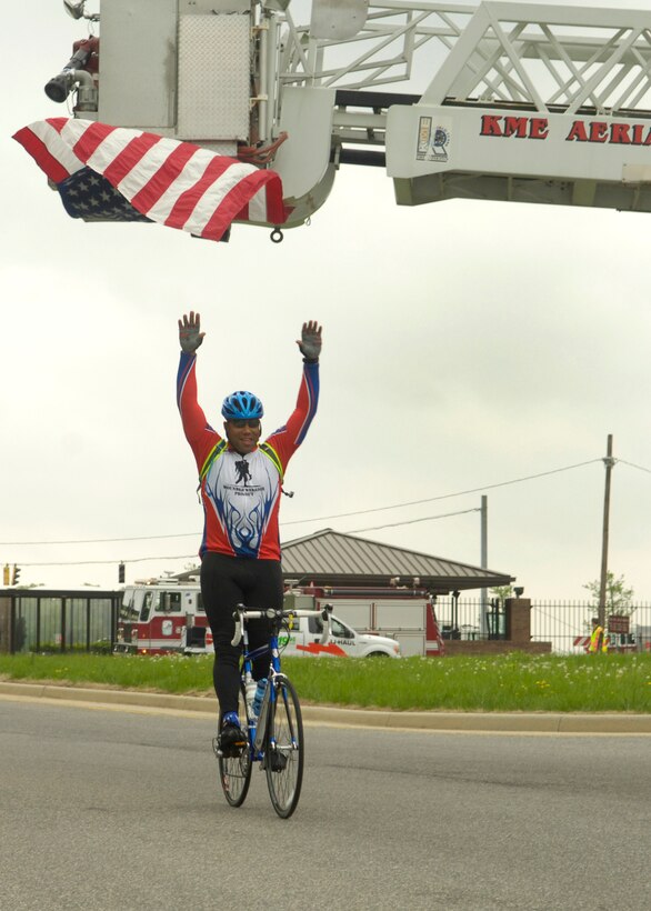 A participant in the wounded warrior soldier ride cycles through the North gate as they exit Andrews Air Force Base Md., on May 1, 2009. The wounded warriors rode from Andrews to Annapolis, Md., as a part of a four day event to raise awareness of issues that veterans are challenged with when they return wounded from the war and for many, the soldier ride provides an important step in their return to an active lifestyle. (U.S. Air Force photo by Senior Airman Renae L. Kleckner)