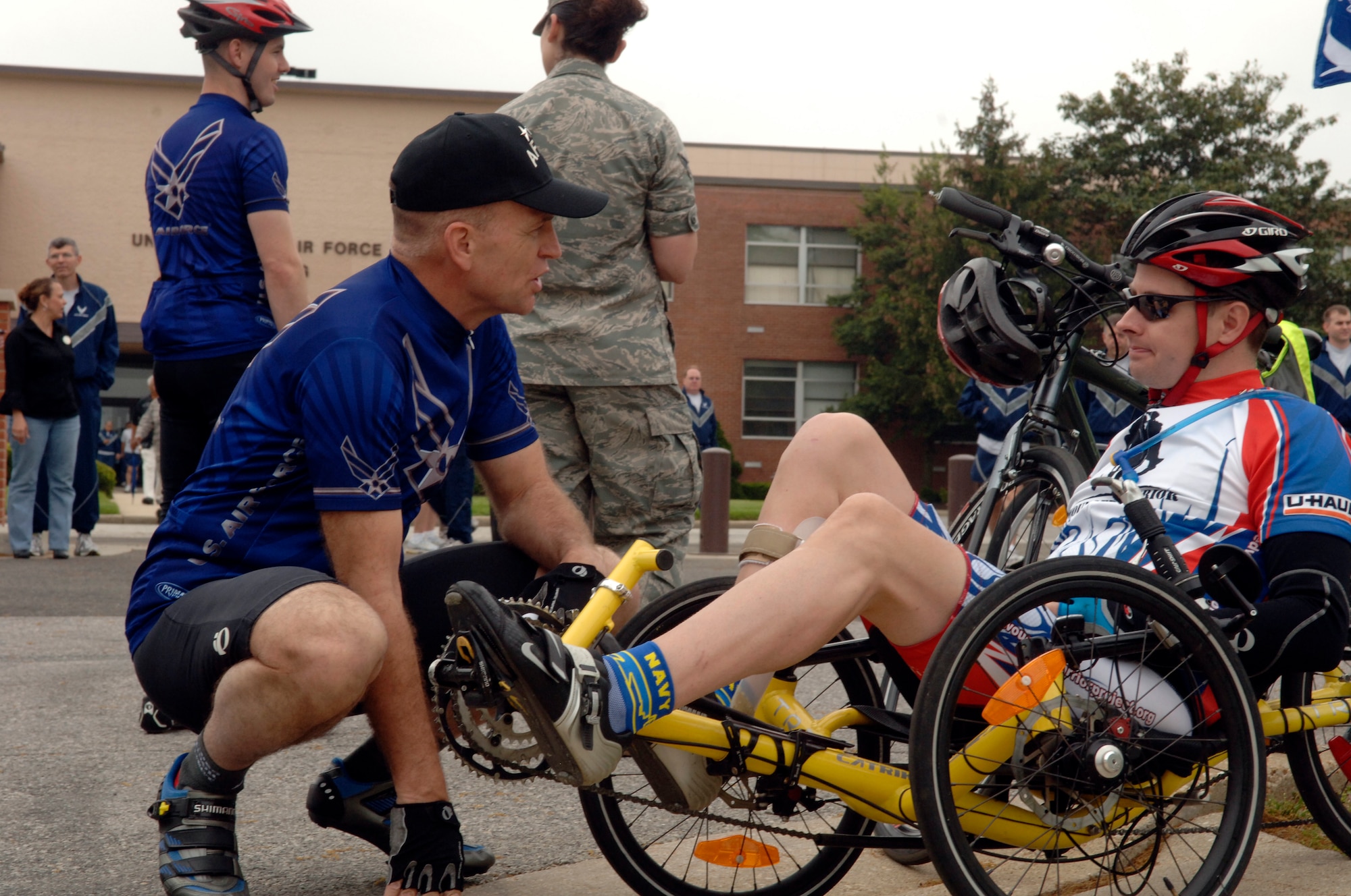 Major General Ralph Jodice, Commander, Air Force District of Washington, extends his appreciation to Navy Lt. Commander Steven Pace prior to participating in the Wounded Warrior Cycle Ride at Andrews Air Force Base on May 1, 2009. The wounded warriors rode from Andrews to Annapolis, MD.,, as a part of a four day event to raise awareness fo issues that veterans are challenged with when they return wounded from the war and for many, the soldier ride provides an important step in their return to an active lifestyle. (US Air Force photo by Senior Airman Keyonna Fennell)