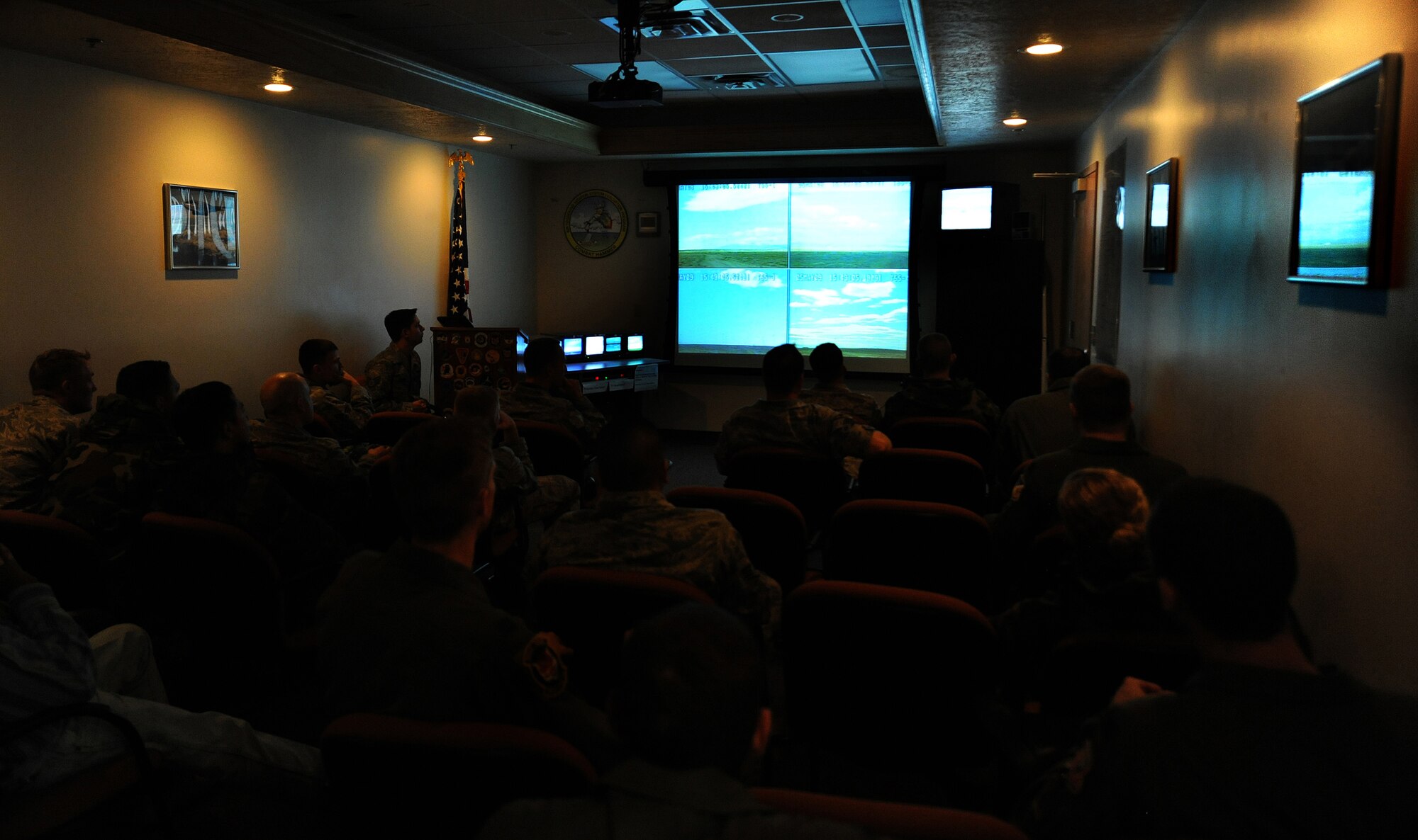 Members of Team Holloman watch from cameras and other devices at the range that record mission information from the time the weapon is dropped to the time it impacts during Combat Hammer at Hill AFB, Utah, May 5. The recorded information from the sorties are used to provide initial feedback to the Combat Hammer players. (U.S. Air Force photo/Senior Airman Michael Means)