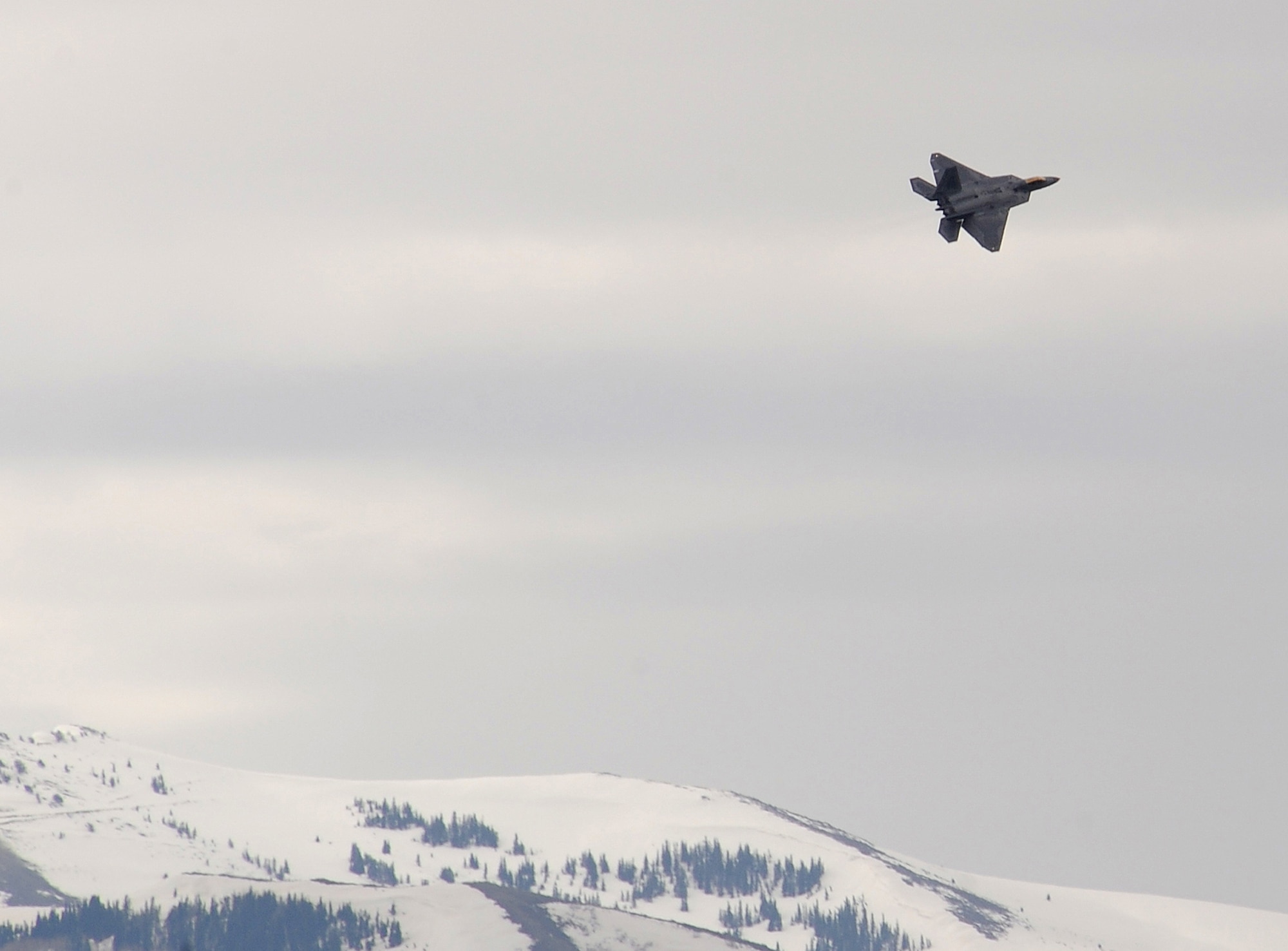 An F-22 from Holloman Air Force Base fly's over Hill AFB, Utah during Combat Hammer, May 5. Combat Hammer performs sixty-five percent of there operations at the Utah Test and Training Range.  (U.S. Air Force photo/Senior Airman Michael Means)