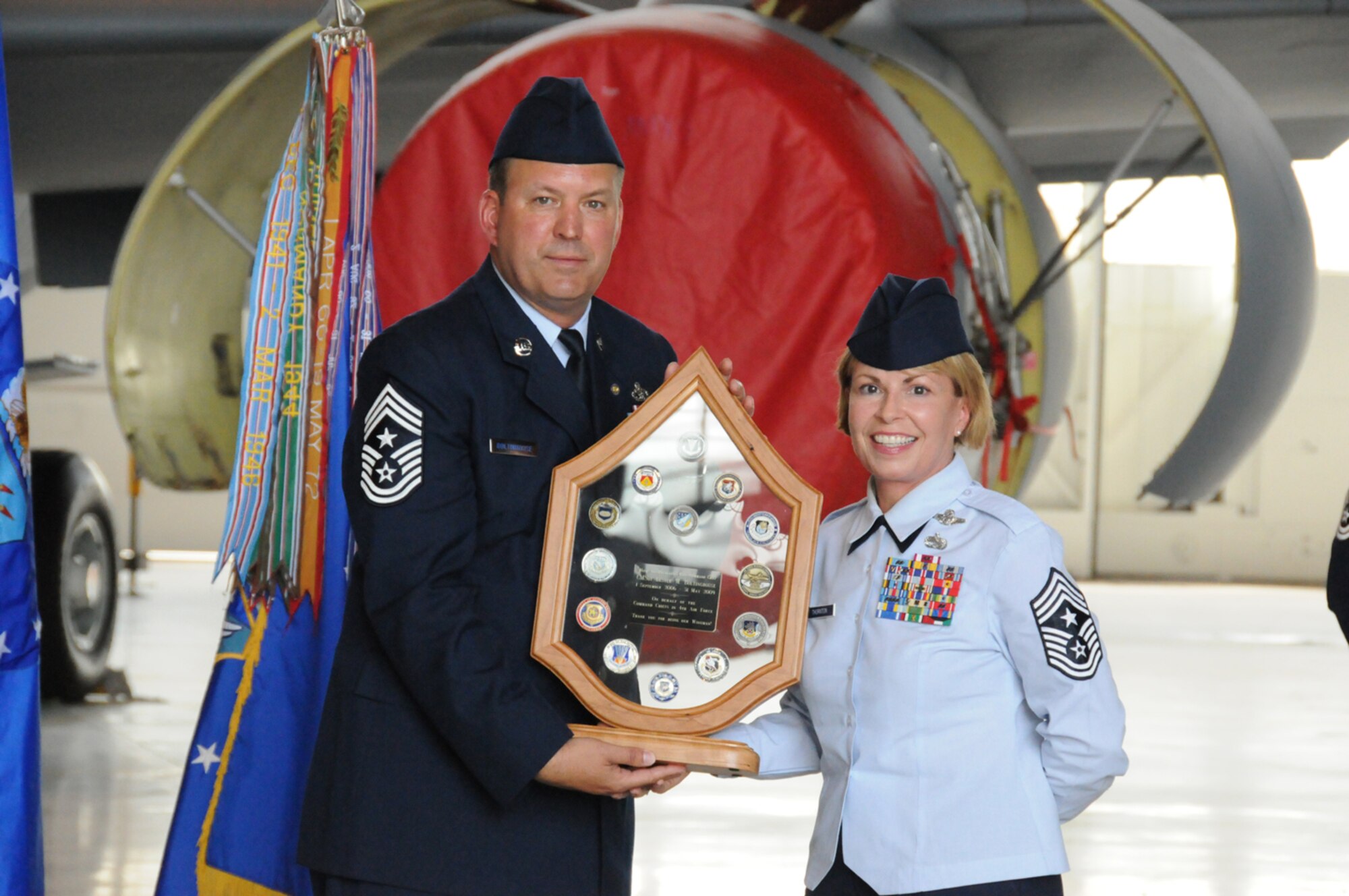 SEYMOUR JOHNSON AIR FORCE BASE, N.C. -- Command Chief Master Sgt. Lester Boltinhouse receives a memento of thanks from all the 4th Air Force command chiefs on May 3, 2009. Chief Patricia Thornton, command chief of 4th Air Force, presented the award to Chief Boltinhouse during his retirement ceremony during the May unit training assembly.