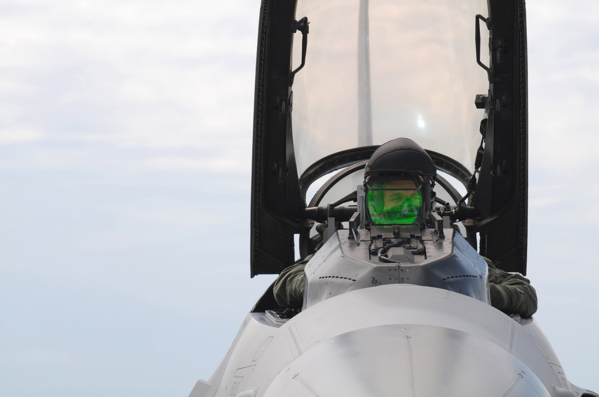 Capt. Kevin Di Falco, 510th Fighter Squadron pilot, goes over a preflight check of F-16 tail number 2057 before taking off on a routine training mission on May 5, 2009. This particular flight pushed the jet past its 7,000 flying hour-mark, which is a first in the Aviano F-16 Fighting Falcon fleet. (U.S. Air Force photo/Staff Sgt. Patrick Dixon)
 