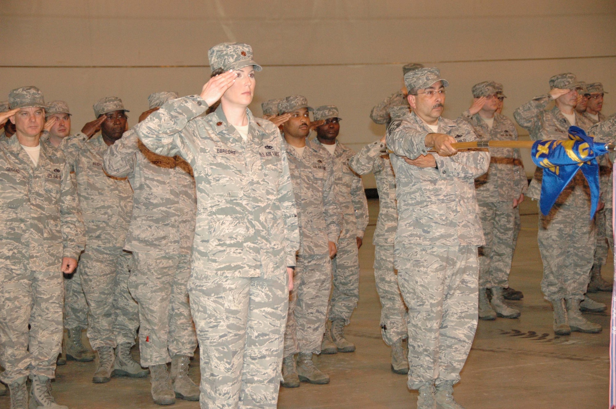 MCGUIRE AIR FORCE BASE, N.J. -- Maj. Karen Ebrecht, commander, 514th Aircraft Maintenance Group, leads her group in a salute as the National Anthem is sung during a May 3 change-of-command ceremony held here. Col. Oreste Varela assumed command of the 514th Maintenance Group. He is now responsible for the aircraft maintenance activities for 32 KC-10A tanker and 13 C-17A strategic airlift aircraft, and will lead a group of over 700. (U.S. Air Force photo/Master Sgt. Donna T. Jeffries)