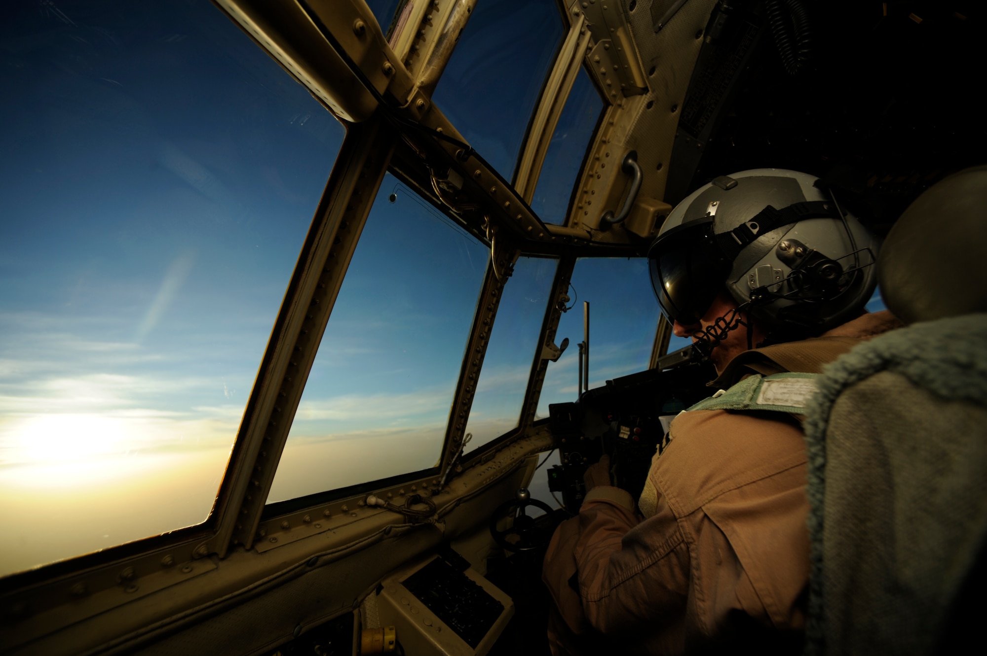 U.S. Air Force Capt. Kenneth Hoekman, a C-130 Hercules pilot from the 746th Expeditionary Airlift Squadron, Southwest Asia, scans the horizon during aeromedical operations on April 23, 2009, in support of Operation Enduring Freedom.  (U.S. Air Force photo by Staff Sgt. James L. Harper Jr.)Released