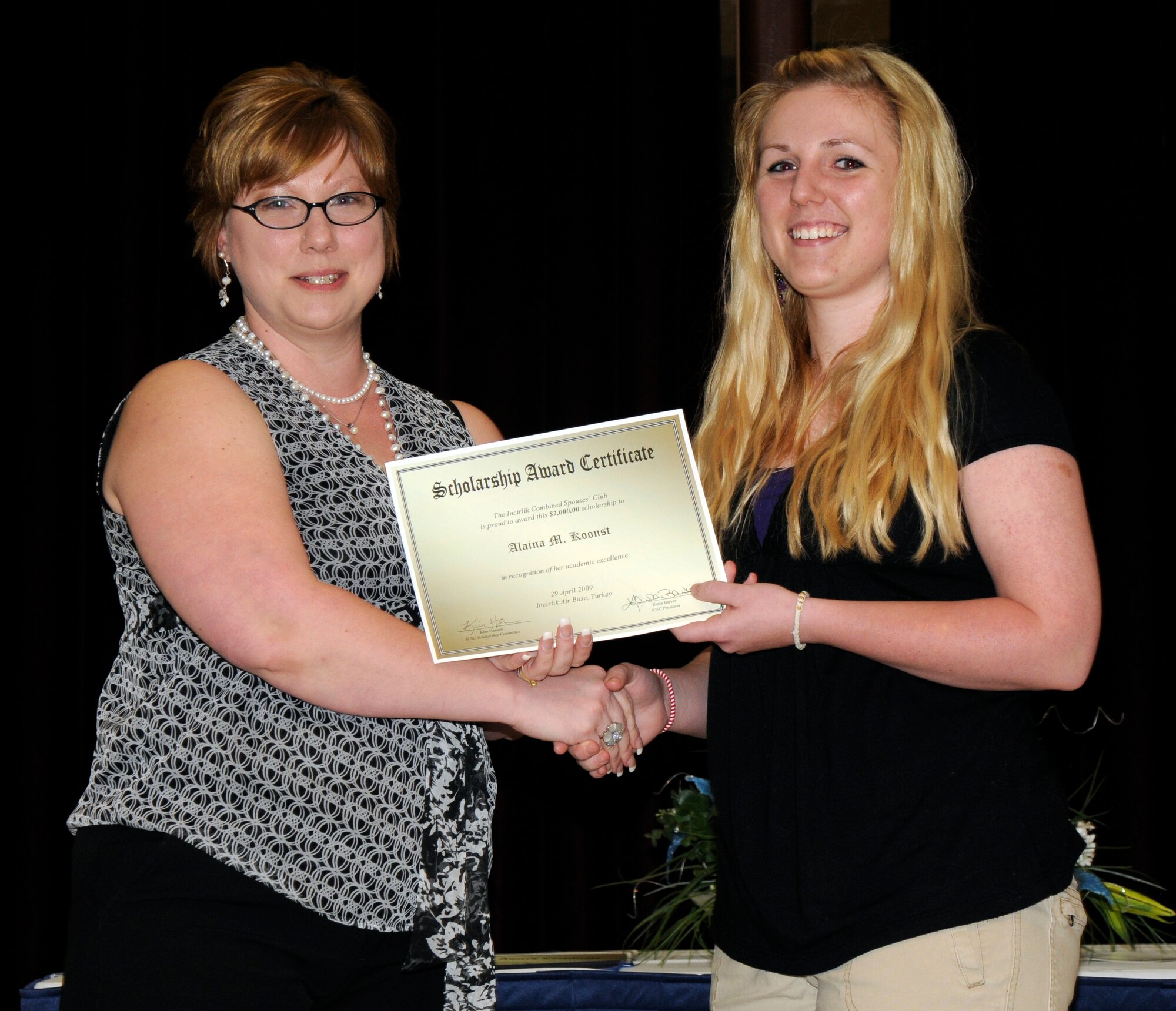 I.C.S.C. President Karla Barker and scholarship recipient Alaina Koonst. (U.S. Air Force photo/Airman 1st Class Amber Russell)