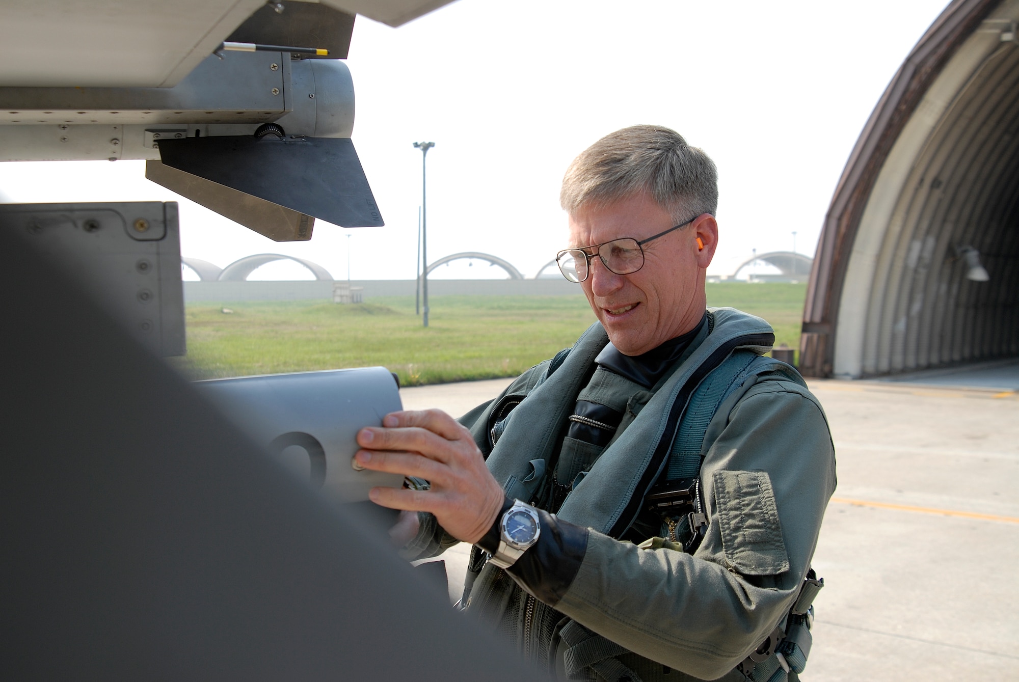 Lieutenant Gen. Jeff Remington, 7th Air Force commander, performs a pre-flight inspection of his F-16 Fighting Falcon at Kunsan Air Base, Republic of Korea, May 6, 2009. General Remington came to Kunsan for a familiarization flight and an All-Call with Wolf Pack Airmen. (U.S. Air Force Photo by SSgt Jason Colbert)


