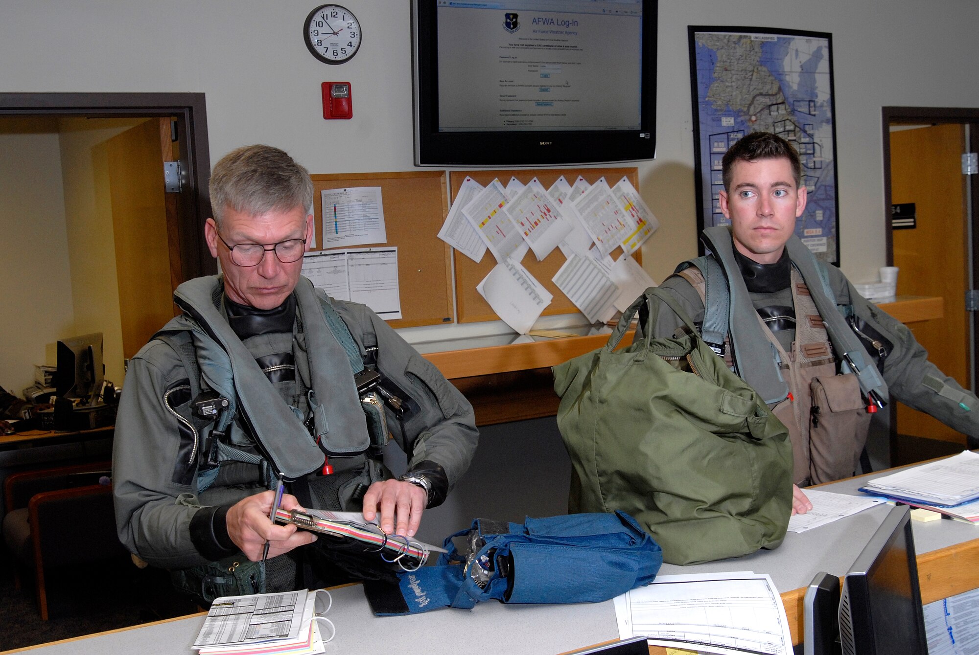 Lieutenant Gen. Jeff Remington, 7th Air Force commander, and Capt. Jesse Proctor, 80th Fighter Squadron, recieve their pre-flight brief at Kunsan Air Base, Republic of Korea, May 6, 2009. General Remington came to Kunsan for a familiarization flight and an All-Call with the Airmen of the Wolf Pack. (U.S. Air Force Photo by SSgt Jason Colbert)

