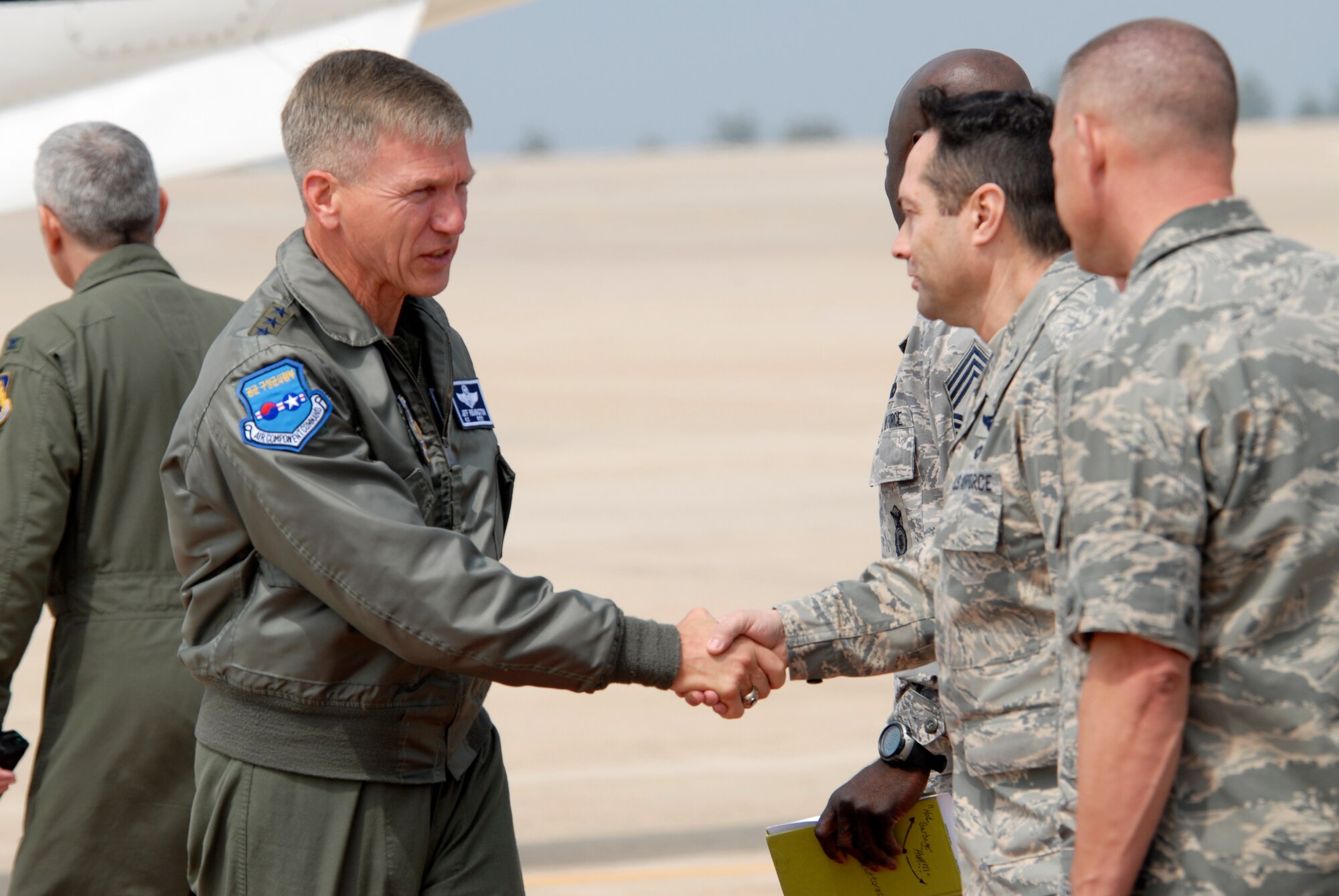 Colonel Robert Nuanes, 8th Mission Support Group commander (right) greets Lt. Gen. Jeff Remington, 7th Air Force commander on his arrival at Kunsan Air Base, Republic of Korea, May 5, 2009. General Remington came to Kunsan for a familiarization flight and an All-Call with the Airmen of the Wolf Pack. (U.S. Air Force Photo by SSgt Jason Colbert)