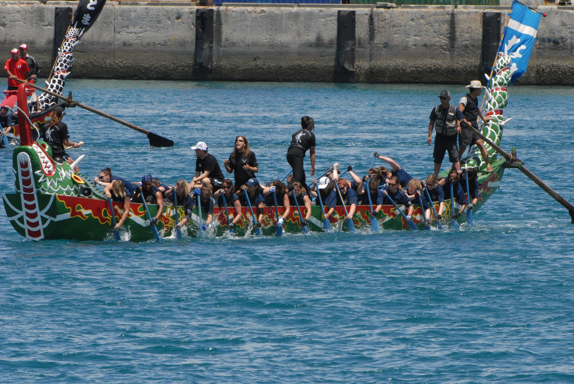 Kadena’s women's team synchronize their rowing to win during one of their heats at the Dragon Boat race May 5 at Tomari Port in Naha City, Okinawa, Japan. The race, which caps off the week-long series of Japanese holidays called Golden Week, has been held annually for centuries in Okinawa. (U.S. Air Force photo/Airman 1st Class Amanda Grabiec)