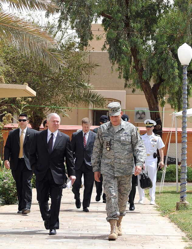 U.S. Defense Secretary Robert M. Gates walks with U.S. Air Force Maj. Gen. Paul "Dutch" Van Sickle, commanding general U.S. Military Training Mission, Eskan Village, Riyadh, Saudi Arabia, May 6, 2009.
