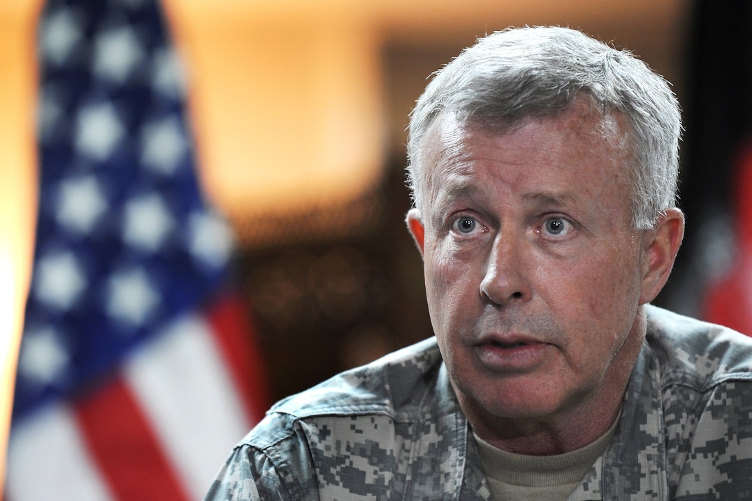 U.S. Army Gen. David McKiernan, commander, U.S. Forces Afghanistan and NATO's International Security Assistance Force, talks to members of the press after their arrival on Camp Eggers, Kabul, Afghanistan, May 6, 2009.