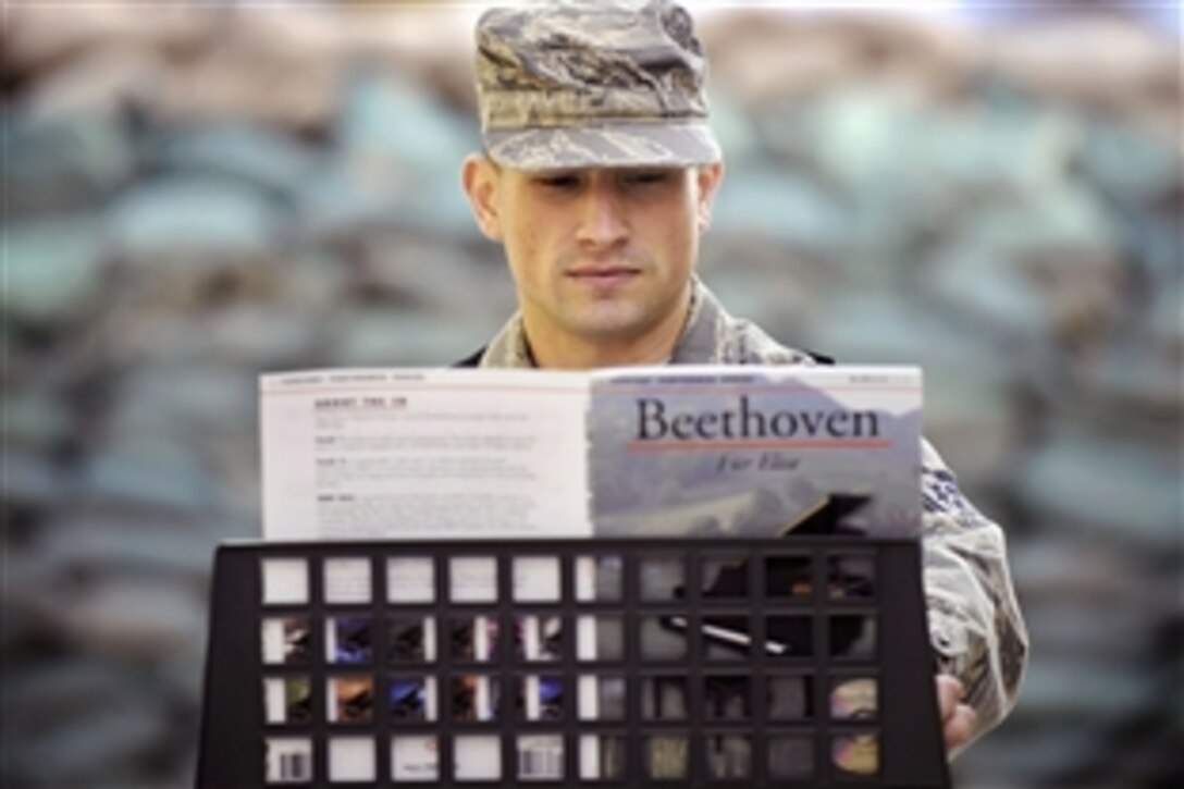 U.S. Air Force Staff Sgt. Eric Began relaxes by playing an electric piano on Forward Operating Base Gardez in Paktia province, Afghanistan, April 21, 2009. Began is a Paktia Provincial Reconstruction Team member.