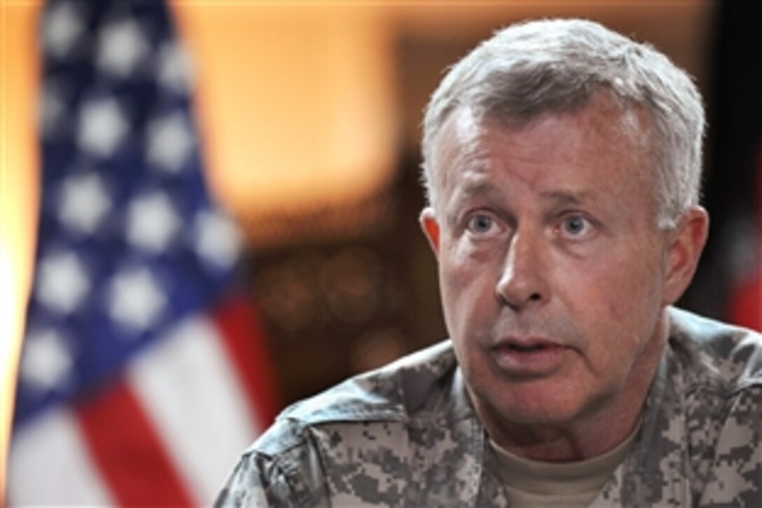 U.S. Army Gen. David McKiernan, commander, U.S. Forces Afghanistan and NATO's International Security Assistance Force, talks to members of the press after their arrival on Camp Eggers, Kabul, Afghanistan, May 6, 2009. 