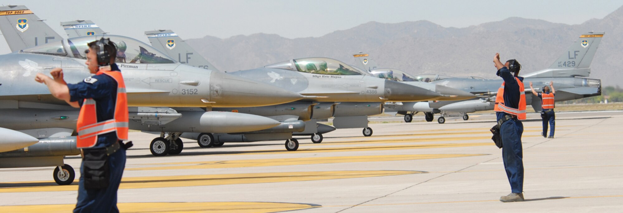 End of runway maintenance crews from Luke Air Force Base participate in a Large Force Employment exercise in which 36 F-16 Fighting Falcons took off back-to-back from the north end of runway April 30.  (U.S. Air Force photo/ Debbie Silliman Wolfe)