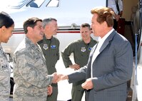 Right to left, California Governor Arnold Schwarzenegger is welcomed to Travis Air Force Base by 60th Air Mobility Wing Vice Commander Colonel James Crowhurst, 60th AMW Operations Group Commander Colonel James Baron 349th Air Mobility Wing Vice Commander Colonel Barrett Broussard and 60th AMW Chief of Protocol Captain  Patrice Williams.    (U.S. Air Force photo by Civ/Nan Wylie) 