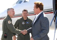 Right to left, California State Governor Arnold Schwarzenegger is welcomed to Travis Air Force Base by 60th Air Mobility Wing Vice Commander Colonel James Crowhurst  and 60th AMW Operations Group Commander Colonel James Baron .(U.S. Air Force photo by Civ/Nan Wylie)