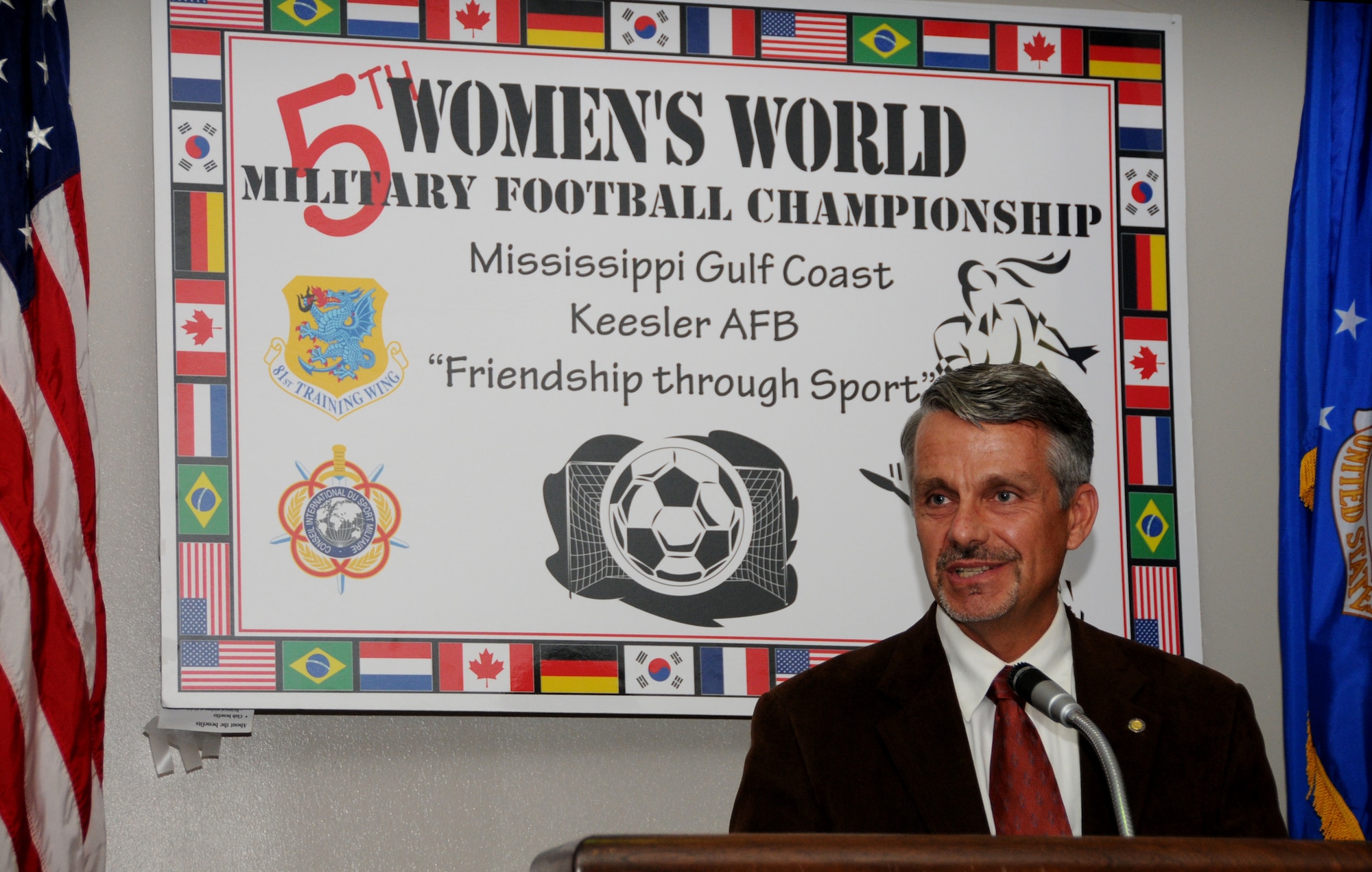 Project officer Brian Mooers speaks during the kickoff ceremony for the 2009 Counseil International Du Sport Militaire Women’s Soccer Championship at Keesler’s marina May 7. The kickoff represents the start of the 30-day countdown till the CISM event begins. Teams from Brazil, Bulgaria, Canada, France, Germany, the Netherlands, the Republic of South Korea and United States will compete to be this year’s international military soccer champion. The tournament also serves as a chance to showcase Keesler and the Mississippi Gulf Coast on an international level.   (U.S. Air Force photo by Kemberly Groue)