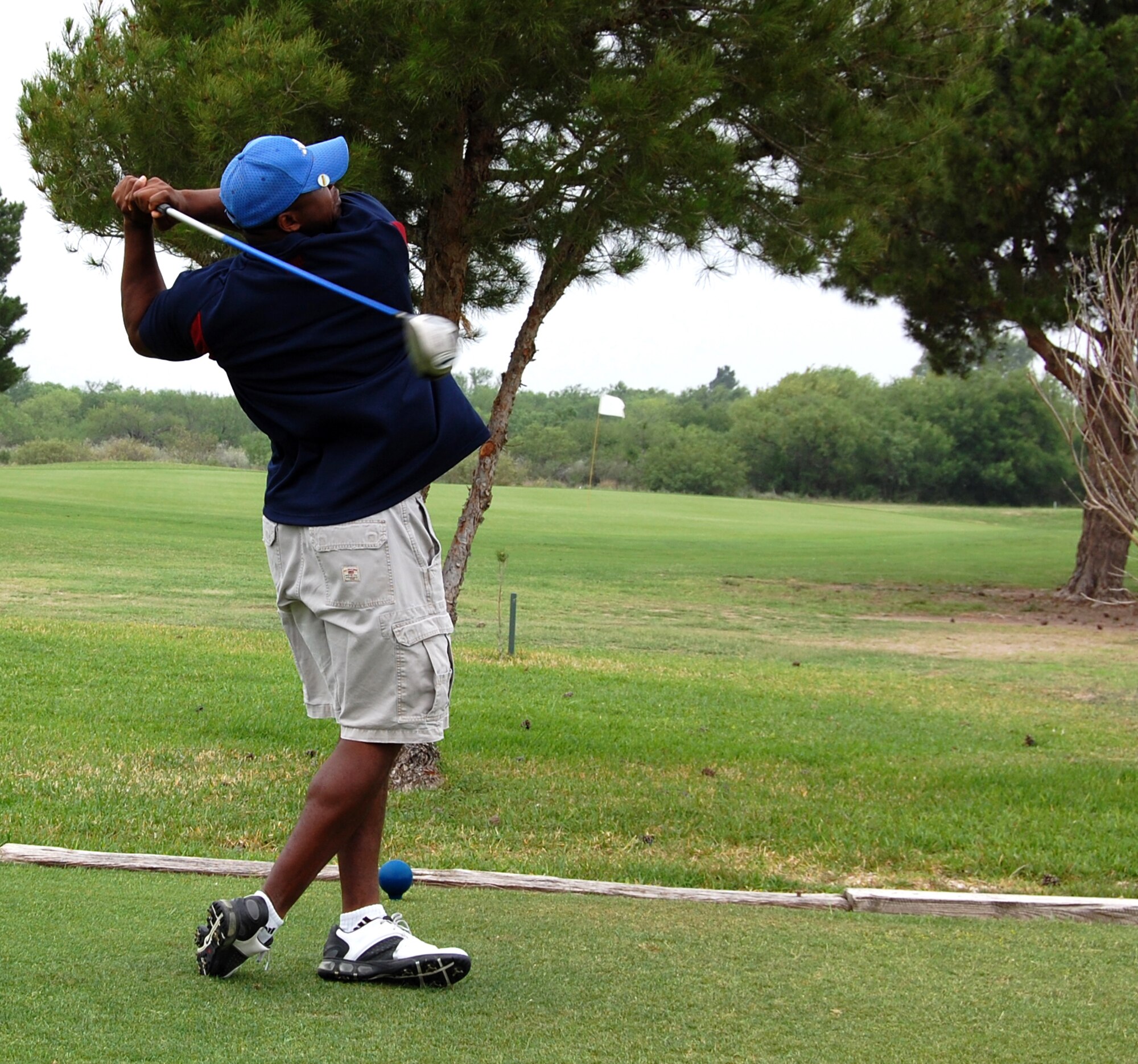 LAUGHLIN AIR FORCE BASE, Texas -- Master Sgt. Rond Sampson, 47th Force Support Squadron, tees off on Hole 11during the Team XL tournament held hereat Leaning Pines Golf Course May 2 . (U.S. Air force photo by Pat Watson)
