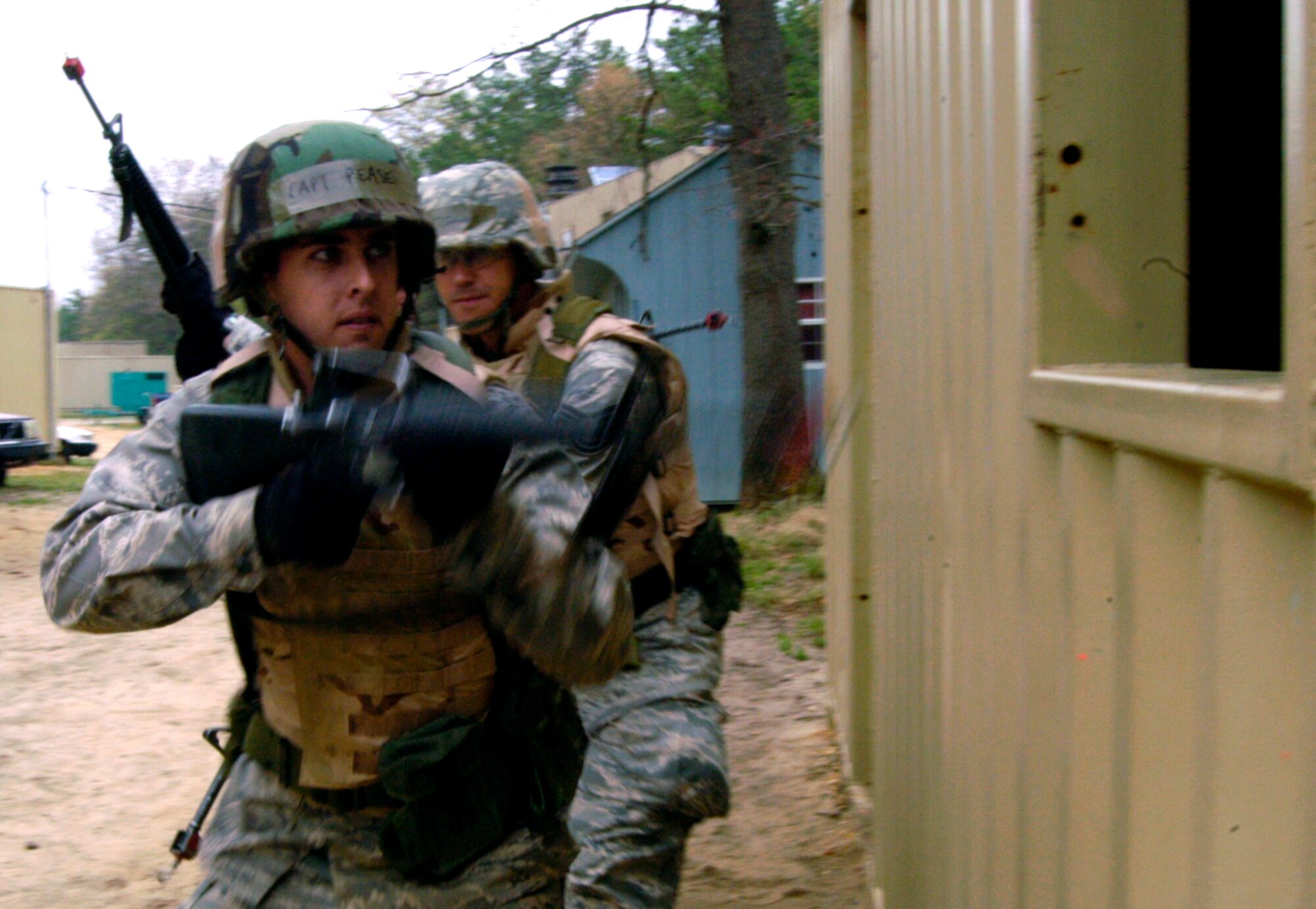 Capt. Casey Pease and other students in the Advanced Contingency Skills Training Course participate in a scenario for military operations in urban terrain training on April 30, 2009, on a Fort Dix, N.J., range.  ACST, taught by the U.S. Air Force Expeditionary Center's 421st Combat Training Squadron on Fort Dix, prepares Airmen for upcoming deployments.  Captain Pease is from Randolph Air Force Base, Texas. (U.S. Air Force Photo/Staff Sgt. J.G. Buzanowski)