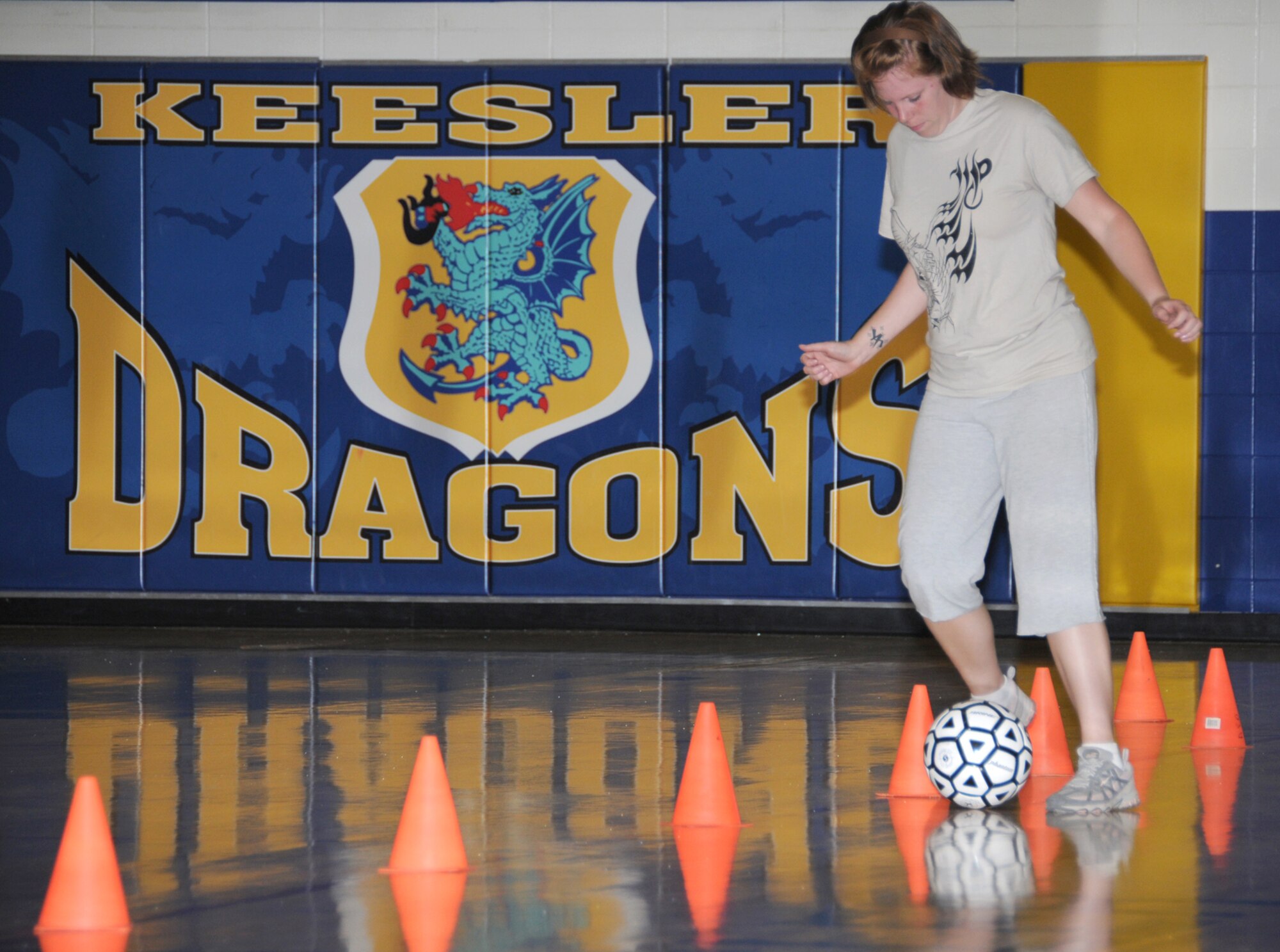Staci Busse, 81st Force Support Squadron, demonstrates some fancy footwork during the obstacle course contest at Blake Fitness Center.  (U.S. Air Force photo by Kemberly Groue)