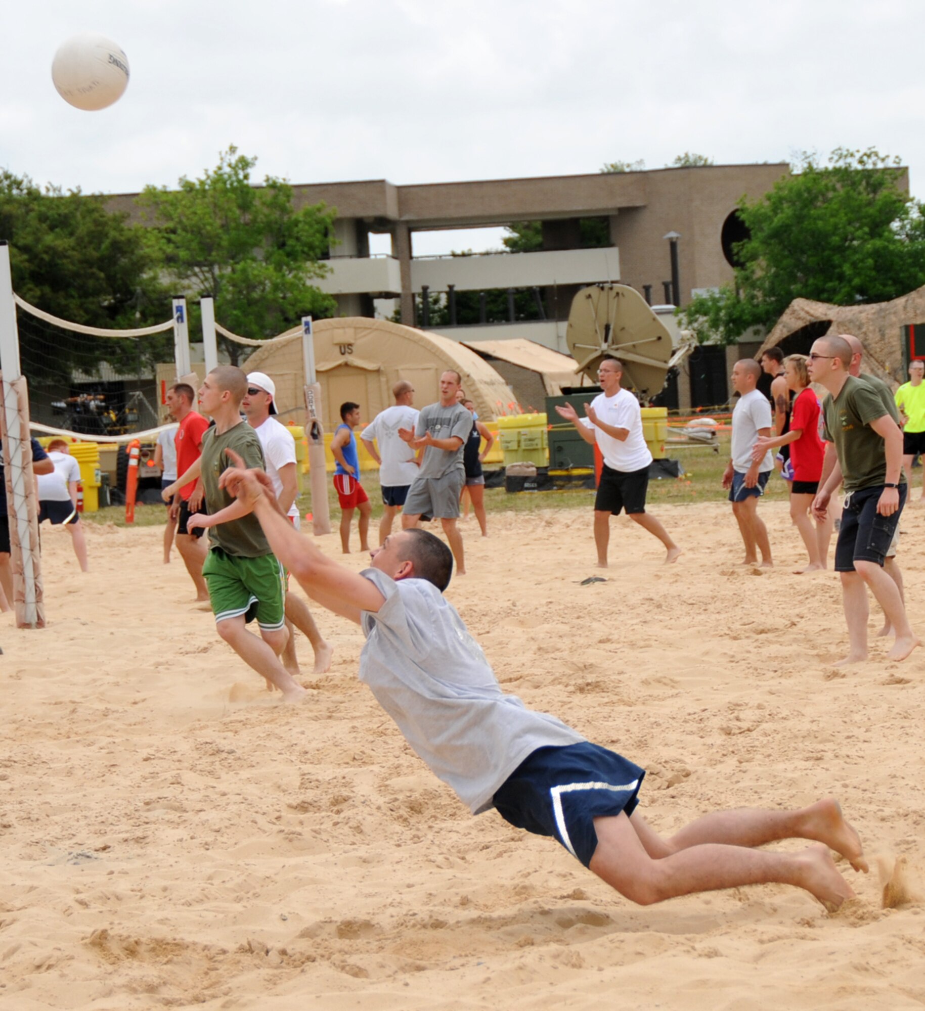 Sean Jennings, 336th Training Squadron, dives for the ball during a sand volleyball game.  (U.S. Air force photo by Kemberly Groue)