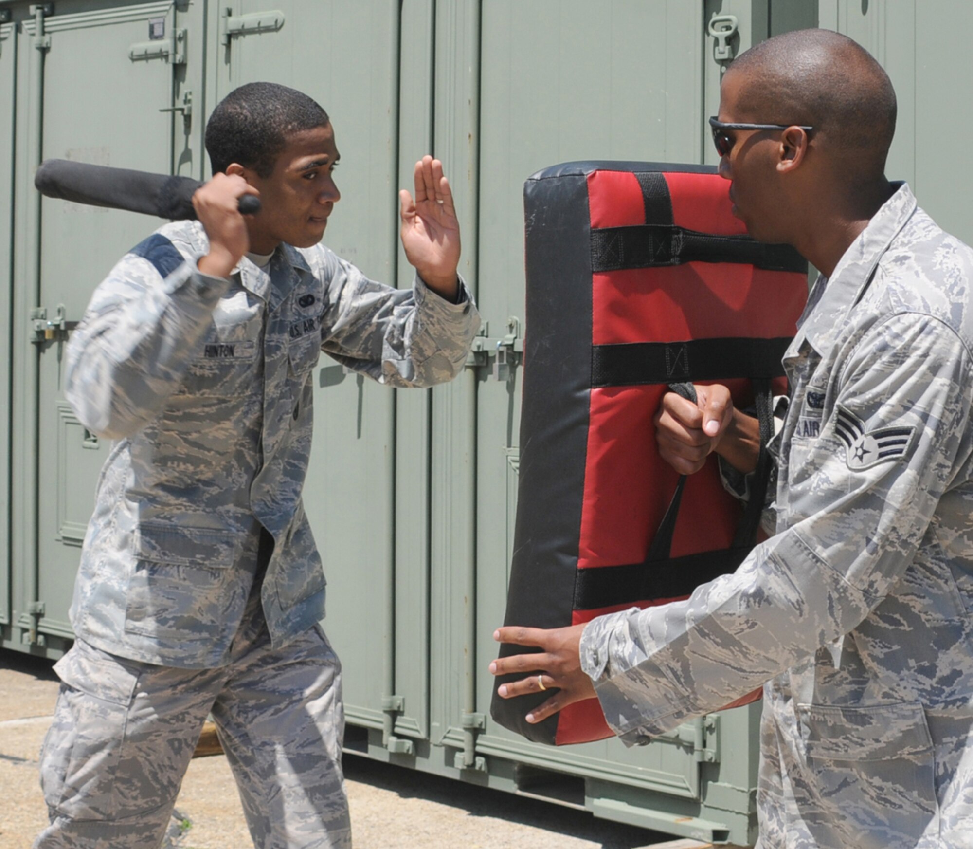 Airman 1st Class Anthony Hinton, left, swings an ASP baton toward Senior Airman Jermaine Wilson during deployment training April 24.  Both are patrolmen with the 81st SFS.  (U.S. Air Force photo by Senior Airman Eric Summers)

