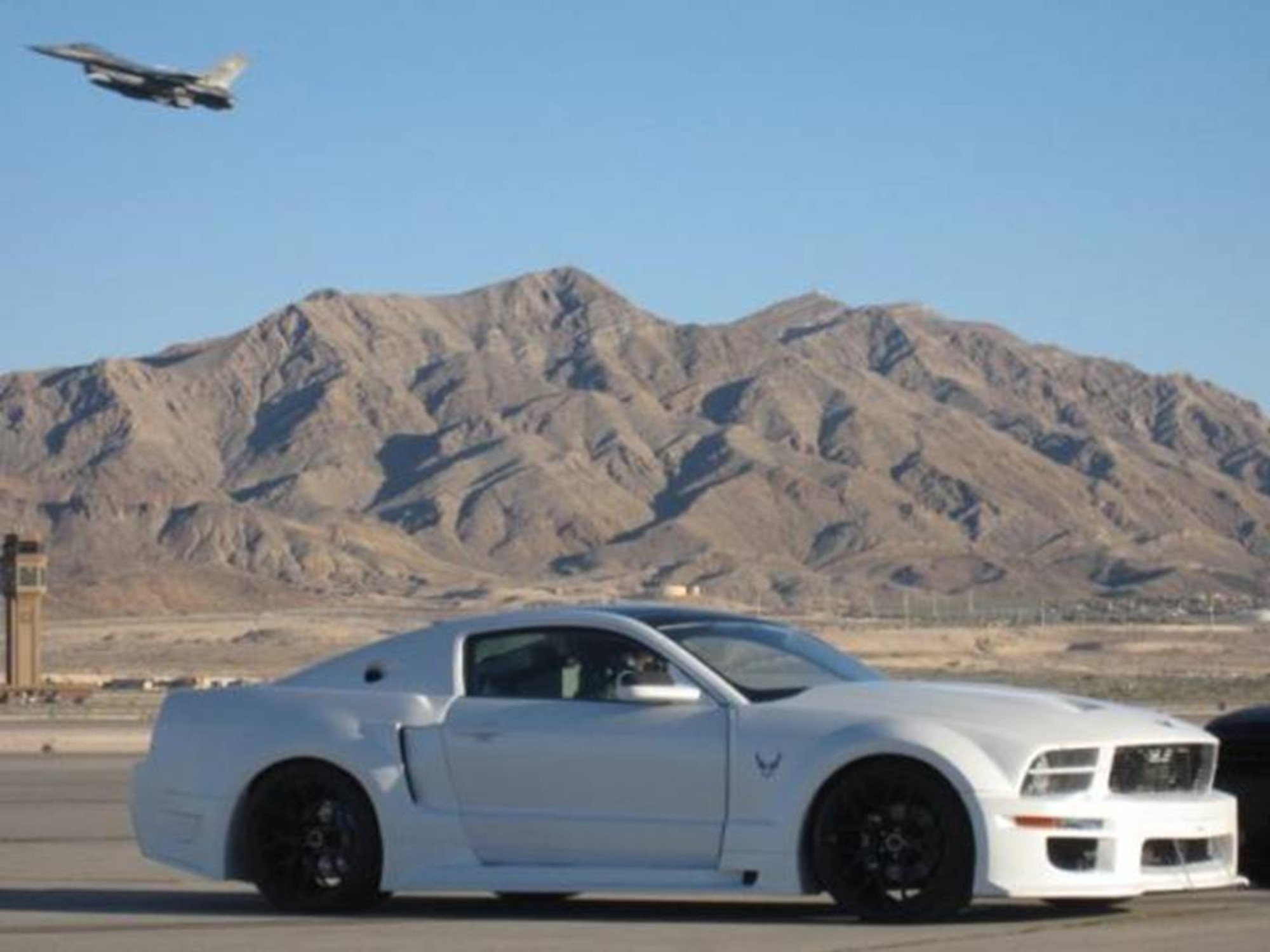 The Air Force X-1 is a Ford Mustang car converted to resemble the inside of an F-16 Fighting Falcon. The X-1 is one of the many new features of Air Force Materiel Command's Freedom's Call Tattoo, which is June 26 on the grounds of the National Museum of the United States Air Force.  (Air Force photo)