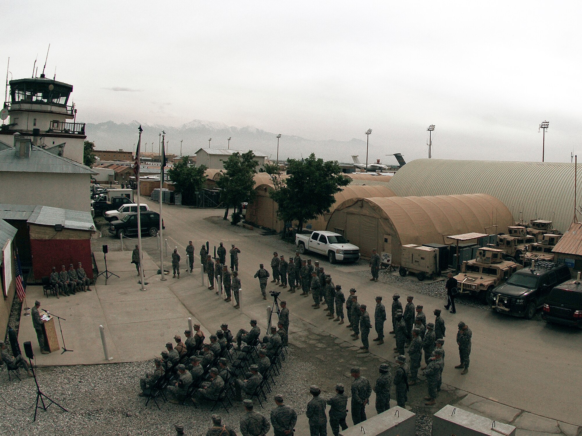 Col. James Reed addresses the crowd during an assumption of command ceremony May 5 at Bagram Airfield, Afghanistan. Four new units, the 655th, 755th, 855th and 955th Air Expeditionary squadrons, were stood up to provide support and oversight of more than 1,200 Airmen serving in more than 40 forward operating bases and camps throughout Afghanistan. Colonel Reed is the 755th Air Expeditionary Group commander. (U.S. Air Force/Staff Sgt. Jason Lake) 
