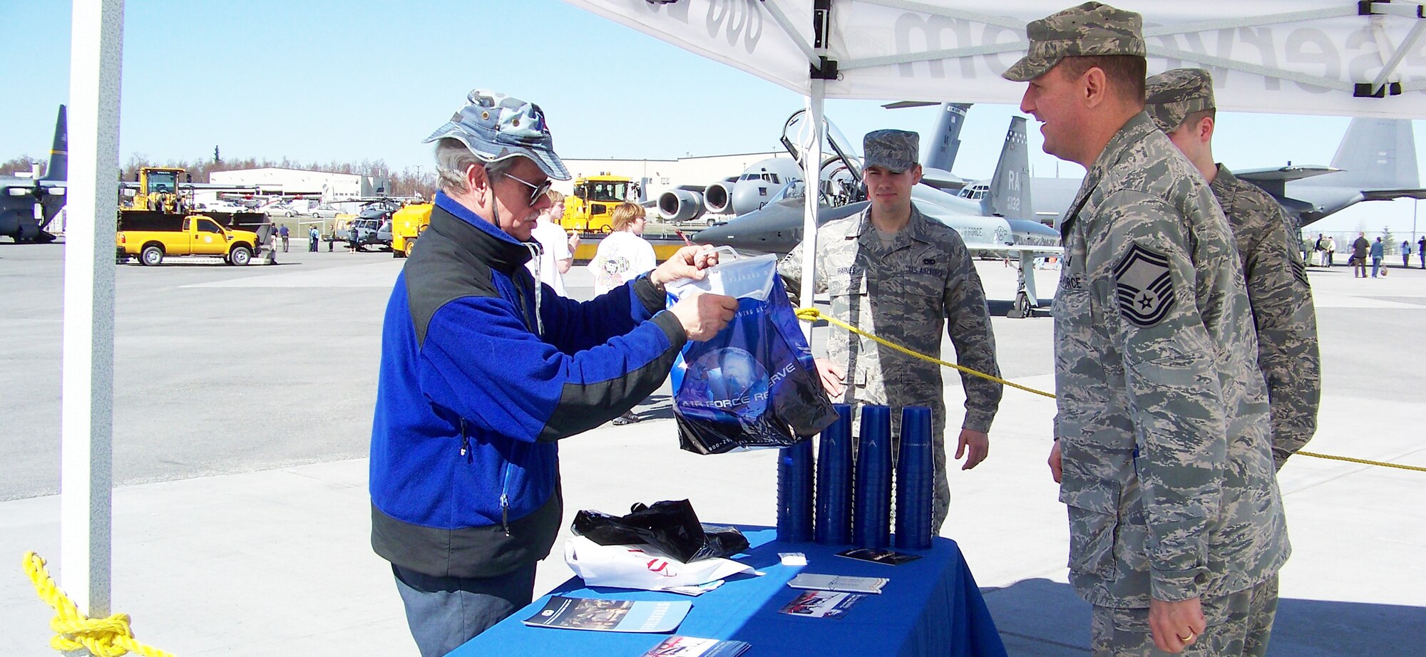 ELMENDORF AIR FORCE BASE, Alaska -- Far right: Senior Master Sgt. Gerald Sutherland, 477th Fighter Group recruiting specialist, discussed Reserve opportunities and handed out information on the Air Force Reserve during the 12th Annual Alaska State Aviation Trade Show & Conference at the Ted Stevens Anchorage International Airport in Anchorage, Alaska, May 2-3. Individuals interested in the 477th Fighter Group can contact Sergeant Sutherland at 907-551-4723. (U.S. Air Force photo/Staff Sgt. Andrea Knudson)